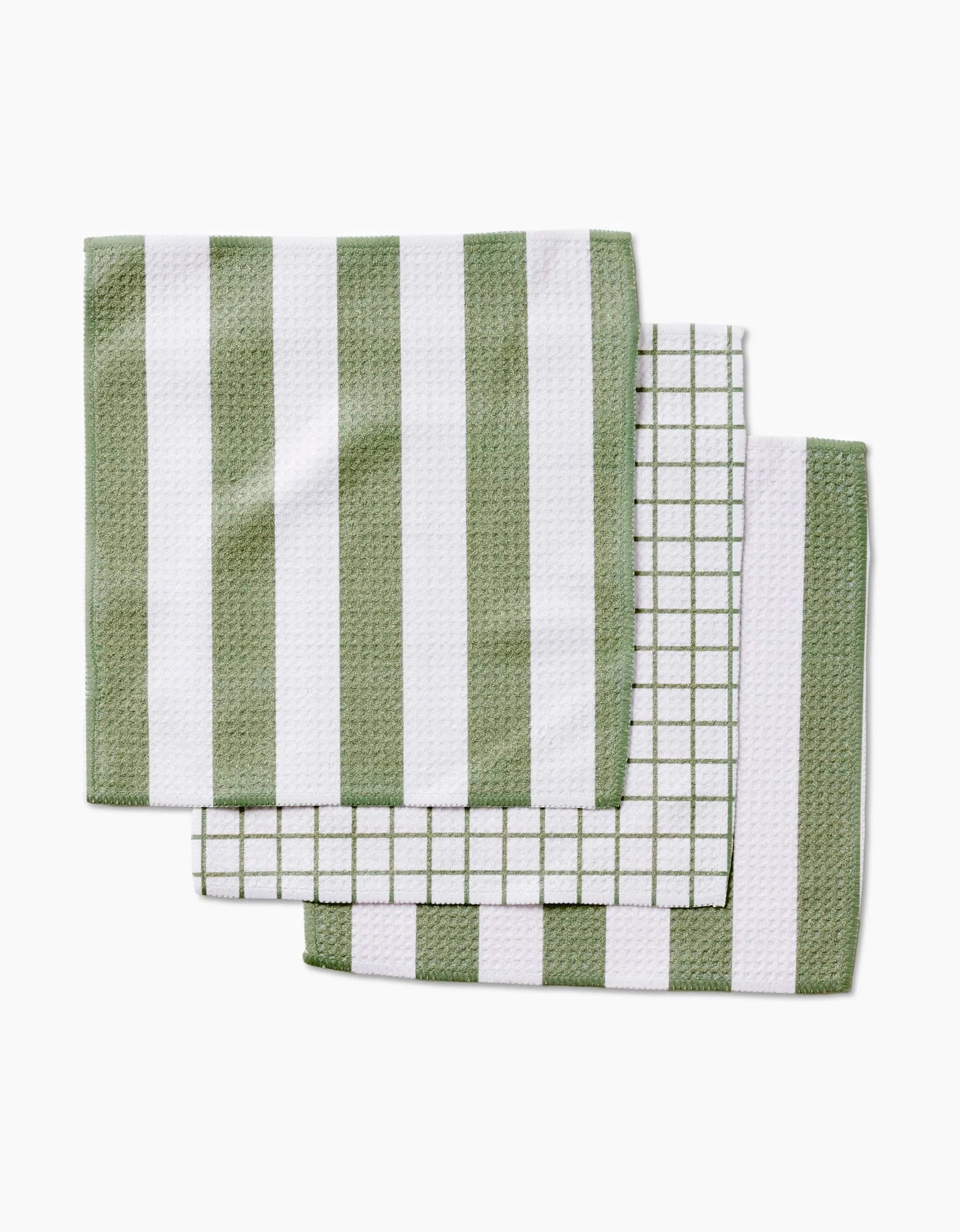 Three Sweet Mint dishcloths by Kailee Wright, made from eco-friendly Geoweave fabric in green and white with wide stripes, thin stripes, and grid patterns, are stacked slightly overlapping on a white background.
