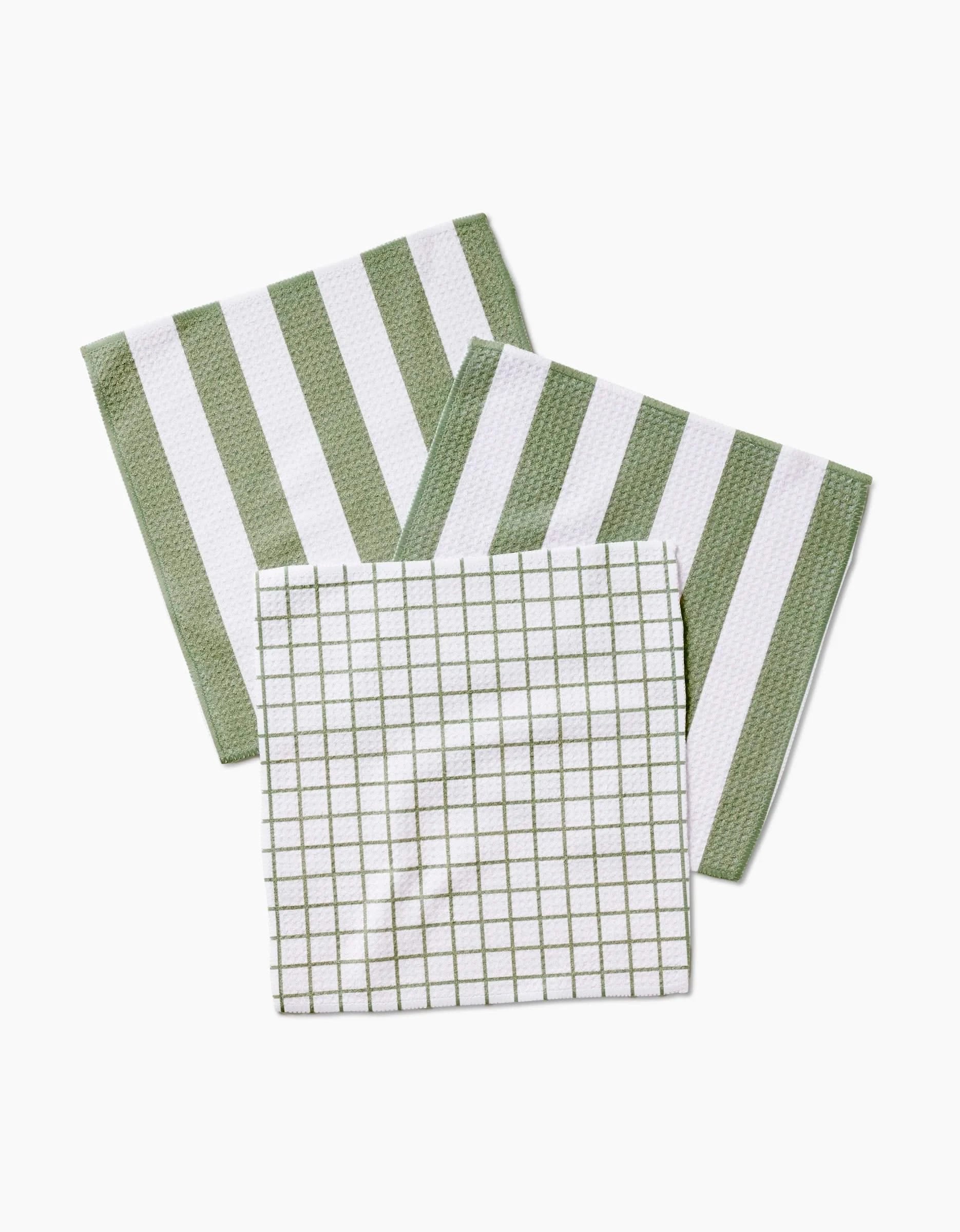 Three Sweet Mint cloth napkins by Kailee Wright are displayed—two with thick green and white stripes, one with a grid pattern—all made from eco-friendly Geoweave fabric and arranged neatly on a white background.