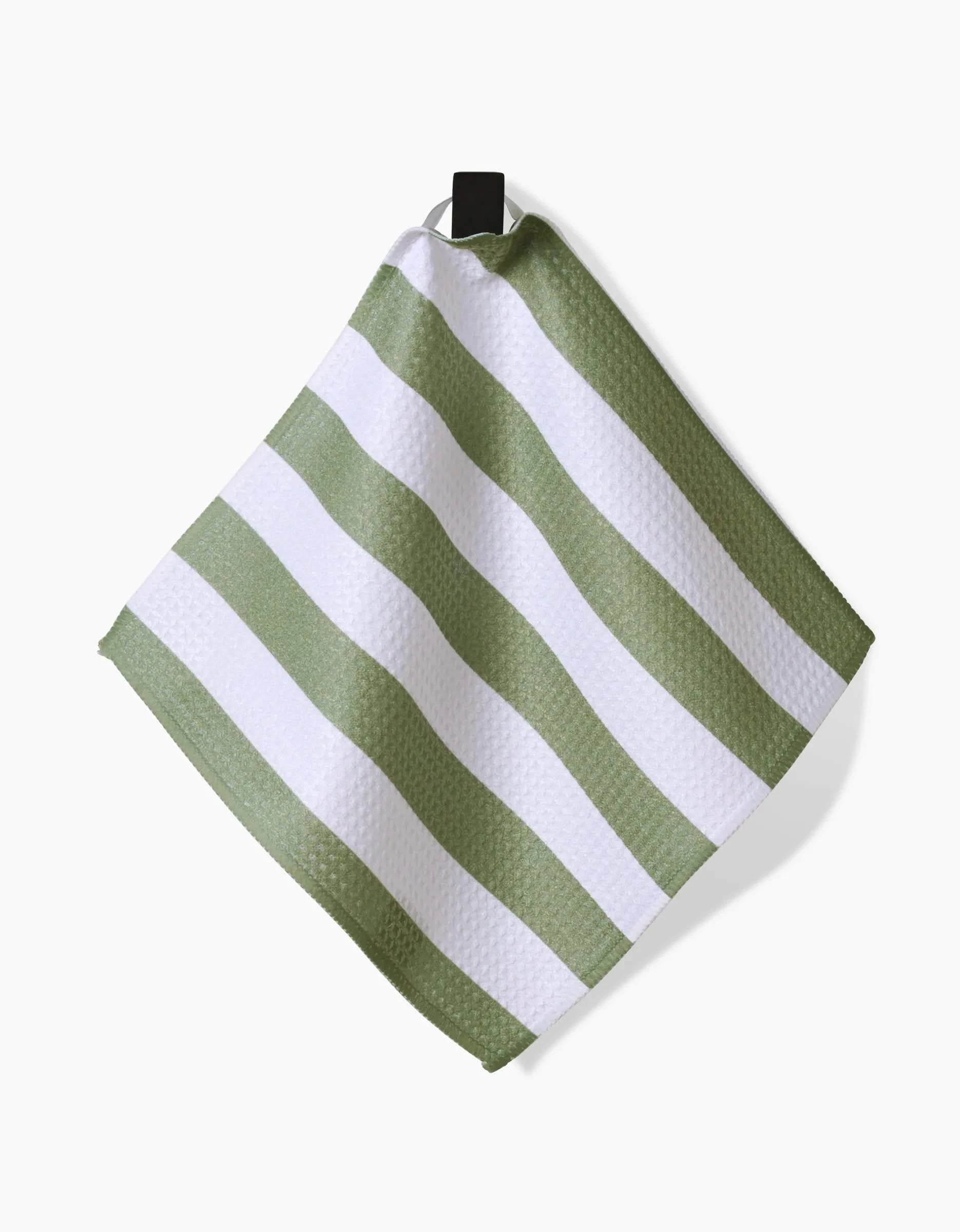 The Kailee Wright Sweet Mint dish towel, featuring eco-friendly Geoweave fabric and a green and white striped textured pattern, hangs from a black loop against a white background.