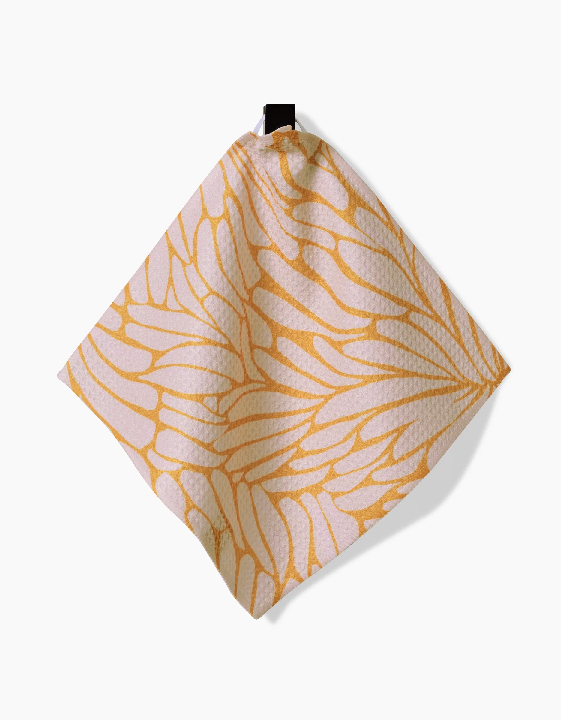 GEOMETRYs Tenderhearted is a square Geoweave cloth with a yellow and white abstract, leaf-like pattern, shown hanging from a black loop on a plain white background.
