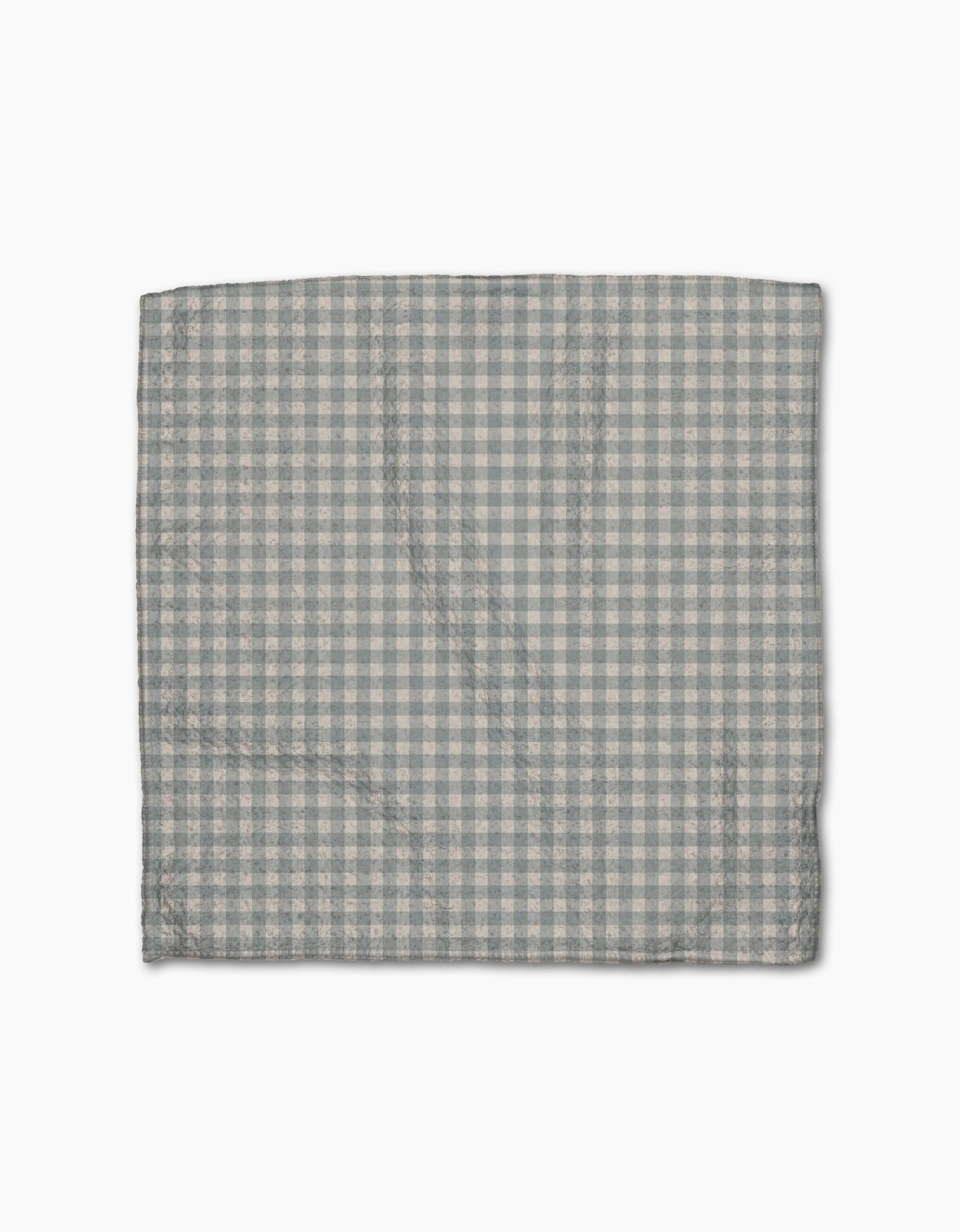 The Jenny Keller Tidepool Check is a folded cloth napkin featuring a light blue and white gingham pattern, fast-drying like a dishcloth, displayed against a plain white background.