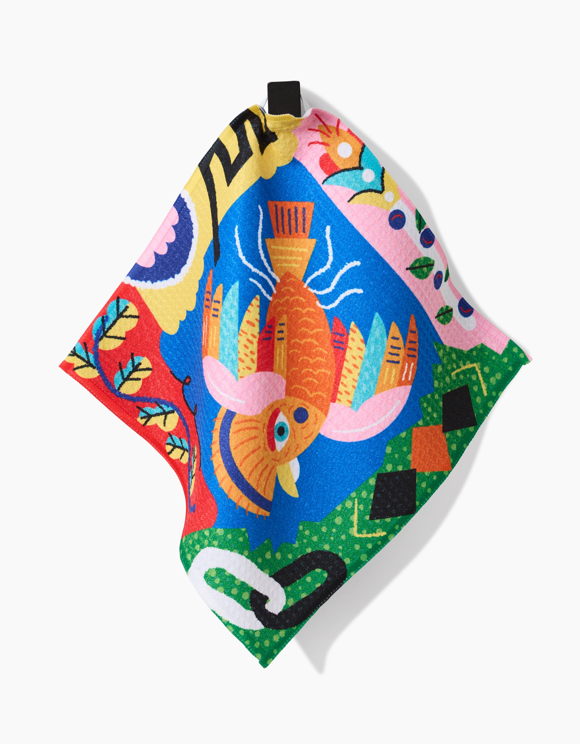 A vibrant Geoweave fabric square from Camila Leão’s Tropical Birds collection, featuring an orange fish with pink fins amid abstract patterns, leaves, and geometric shapes in blue, green, red, yellow, and black.