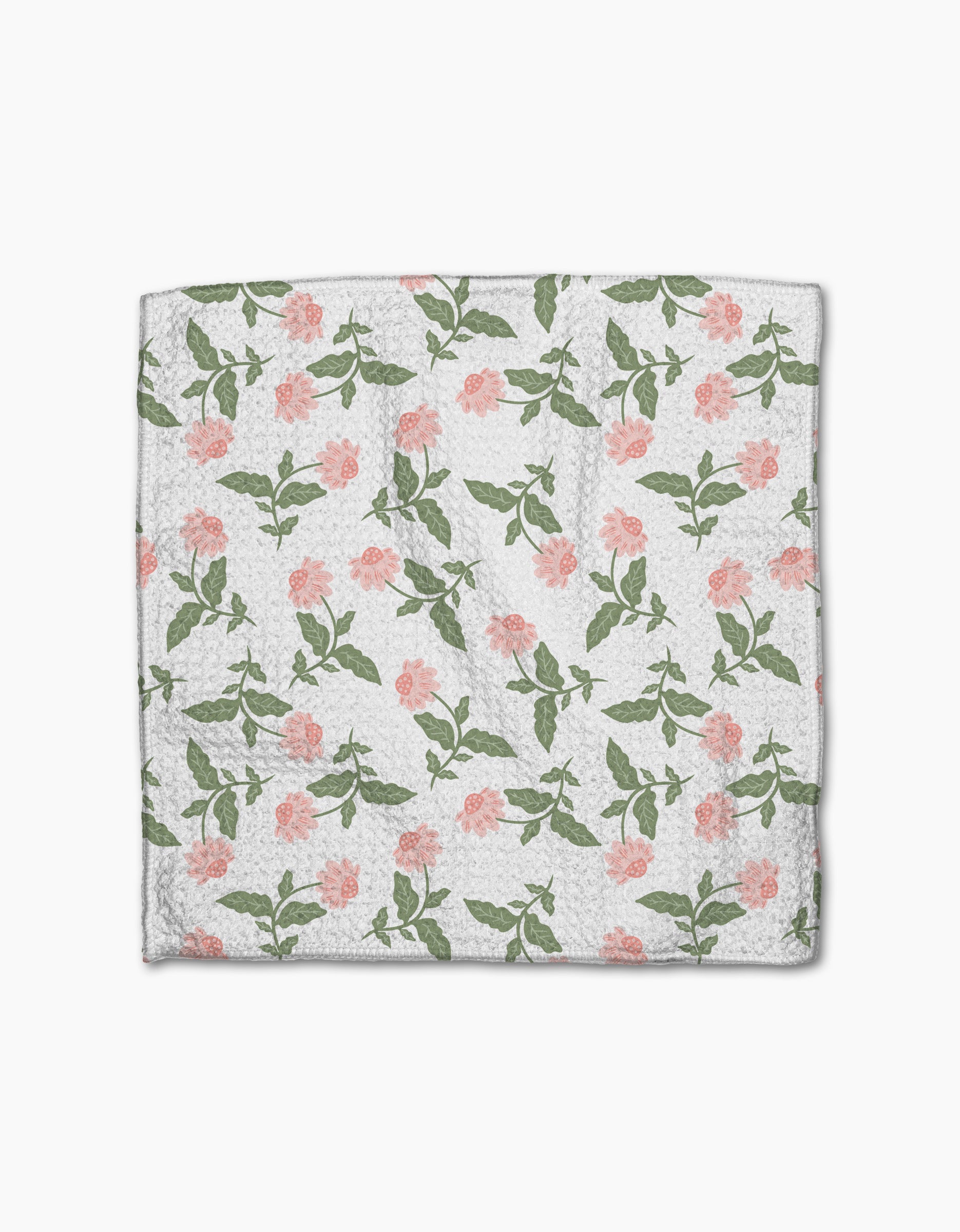 The Danelys Sidron Wildflower Vine Blush is a white Geoweave dishcloth made from recycled materials, featuring pink flower and green leaf patterns evenly scattered across the surface.