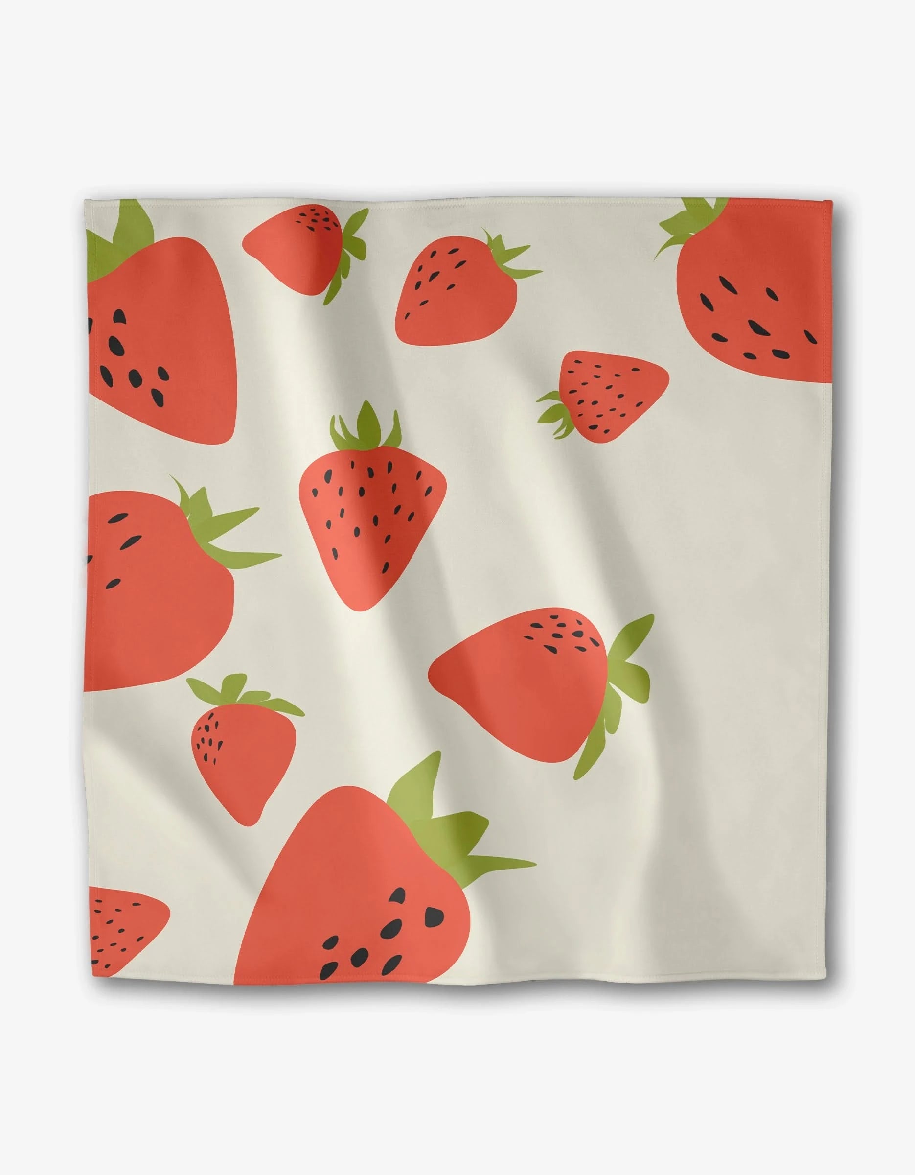 The GEOMETRY Sunny Fruit set includes white dinner napkins made from Geosuede fabric, featuring a playful red strawberry pattern with green tops and black seeds scattered over the surface.