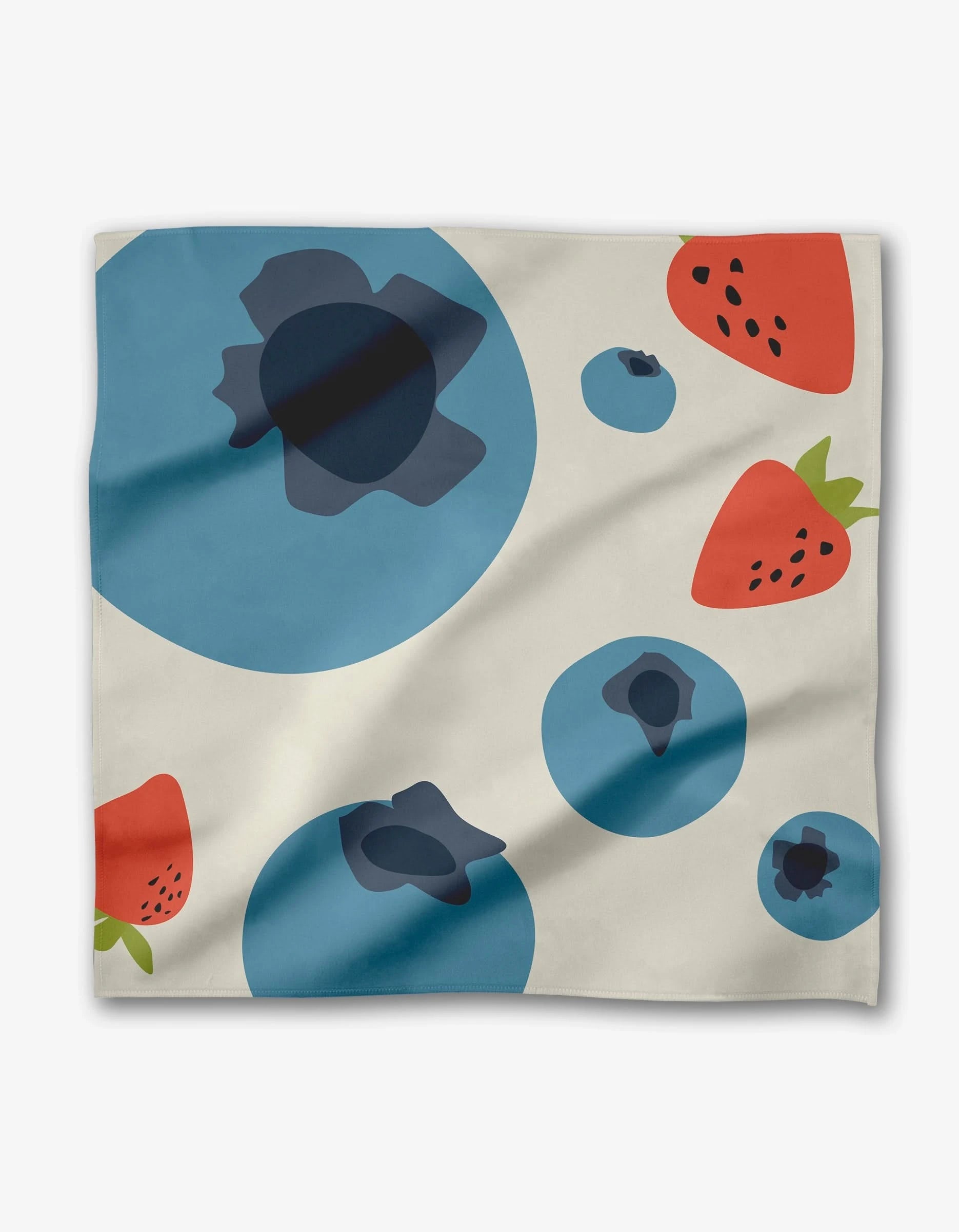 The GEOMETRY Sunny Fruit Dinner Napkin Set is cream-colored, made from Geosuede, and displays playful large blue blueberries and red strawberries with green tops scattered across the surface.