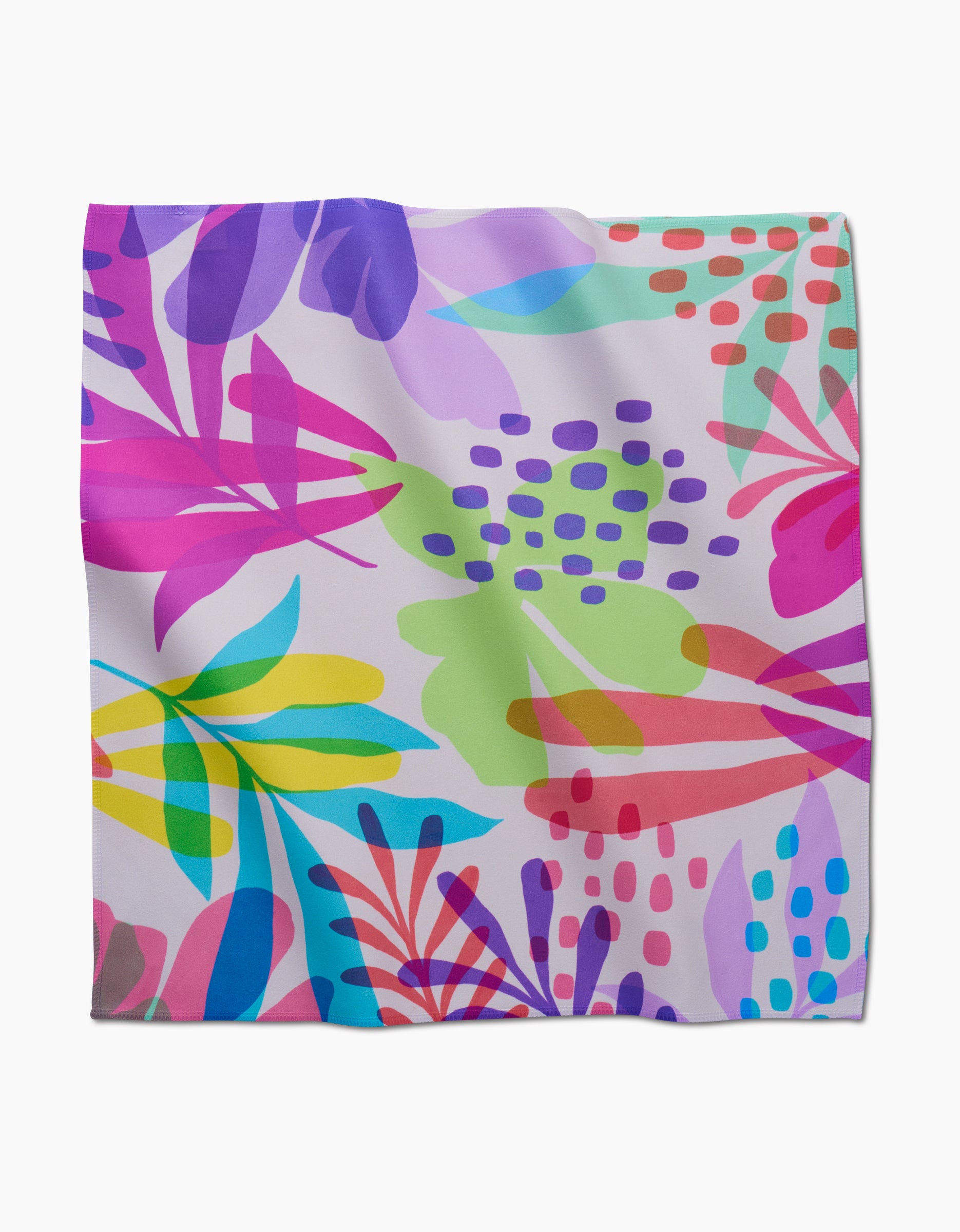 The GEOMETRY Botanical Burst square scarf features a vibrant abstract tropical leaf design in pink, purple, green, blue, yellow, and red on a light background. Made from recycled materials, its modern look highlights overlapping shapes and playful dots.