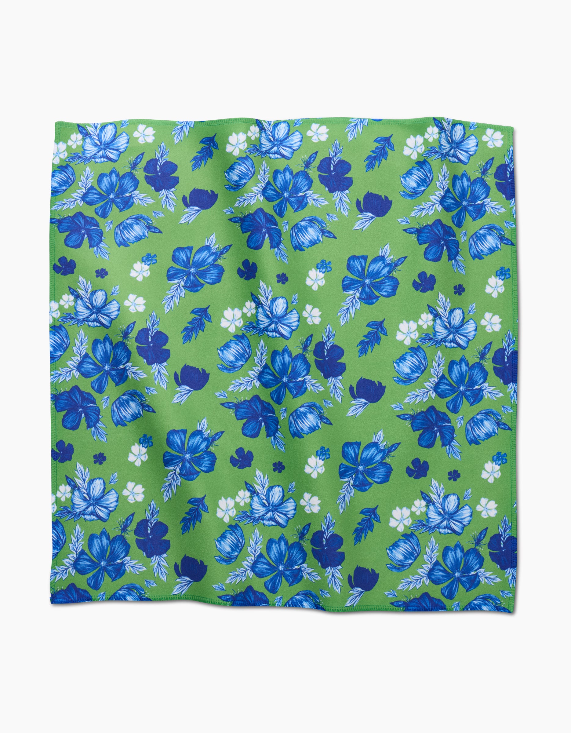 The Flower Bomb by GEOMETRY is a square green Geosuede cloth decorated with blue and white flowers and various shades of blue leaves evenly scattered across the surface.