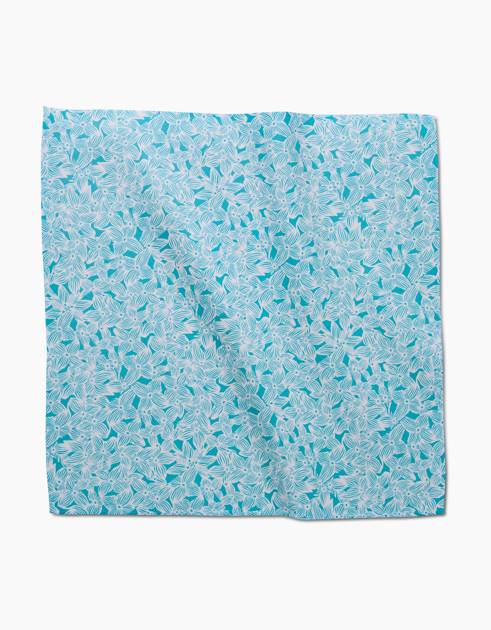 The GEOMETRY Hydrangea is a square Geosuede fabric napkin with a light blue background and detailed white leaf pattern—slightly wrinkled, displayed on white—an elegant addition to any Dinner Napkin Set.