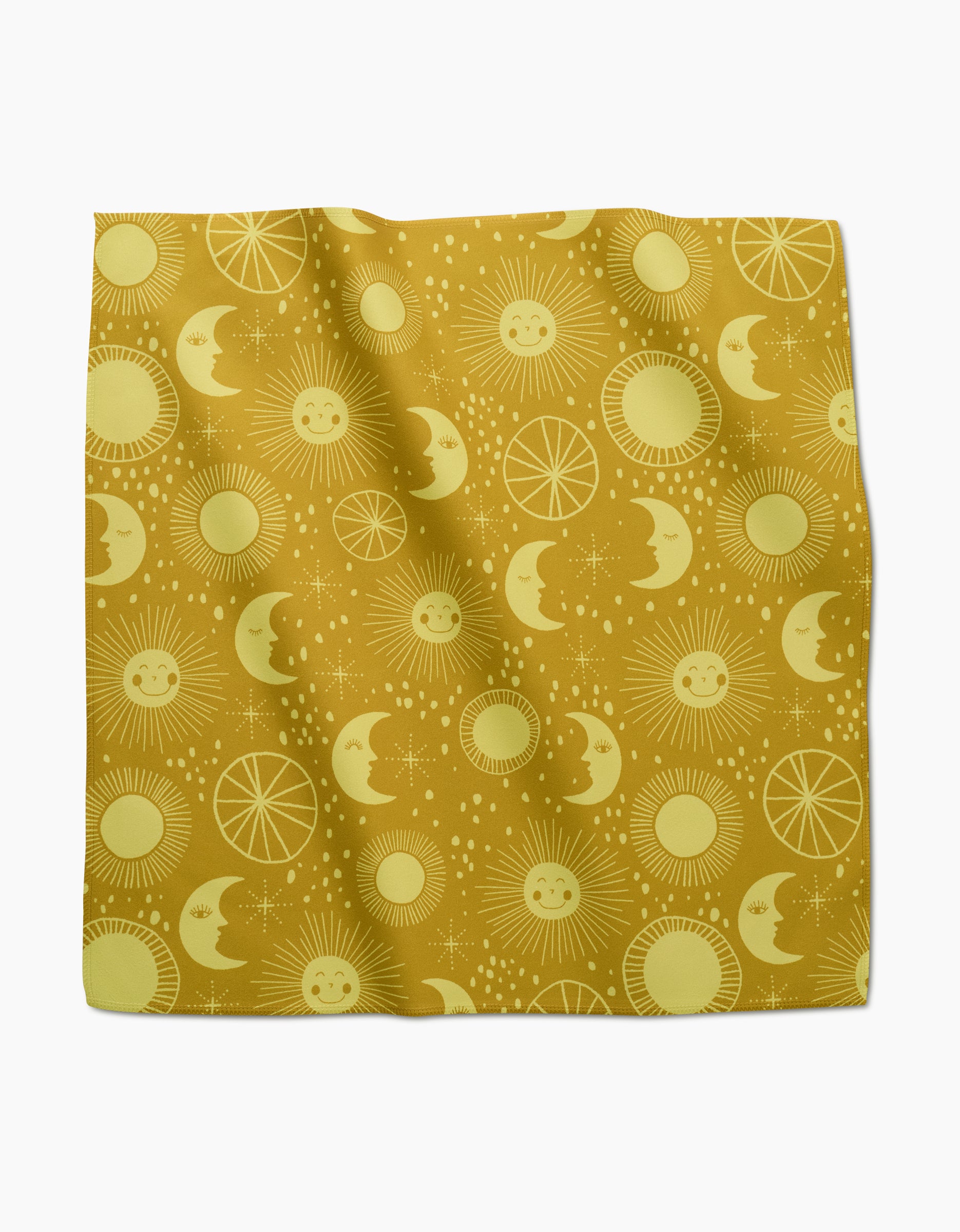 The Jessica Swift Magical Moments Dinner Napkin Set features a yellow cloth with suns, crescent moons, stars, and circular patterns. Eco-friendly and slightly wrinkled, these napkins are displayed on a white background.