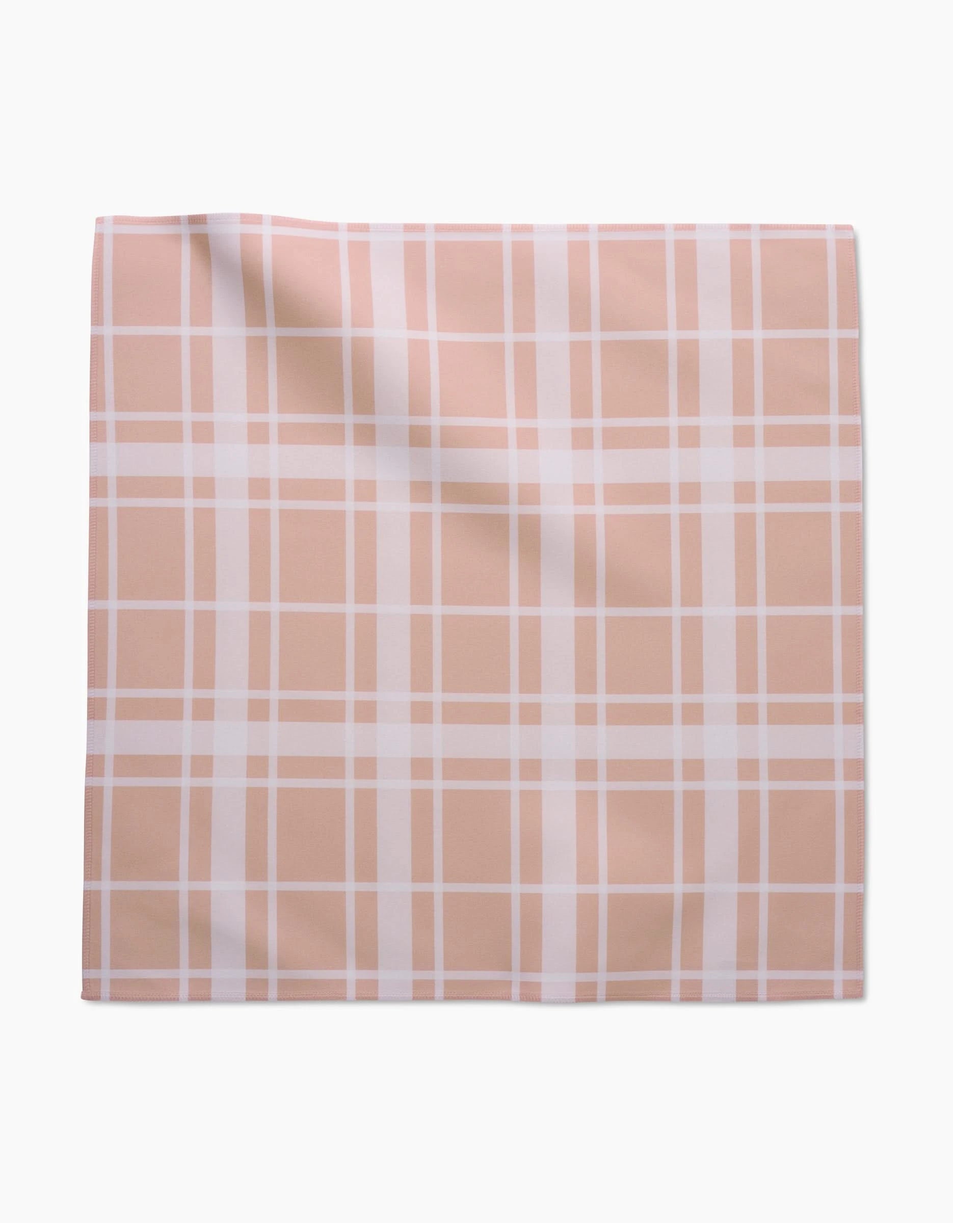 Aubrey Fairchilds Picnic Time Pink Dinner Napkin Set features a soft Geosuede square cloth in light pink and white plaid with evenly spaced lines, shown laid flat against a white background.