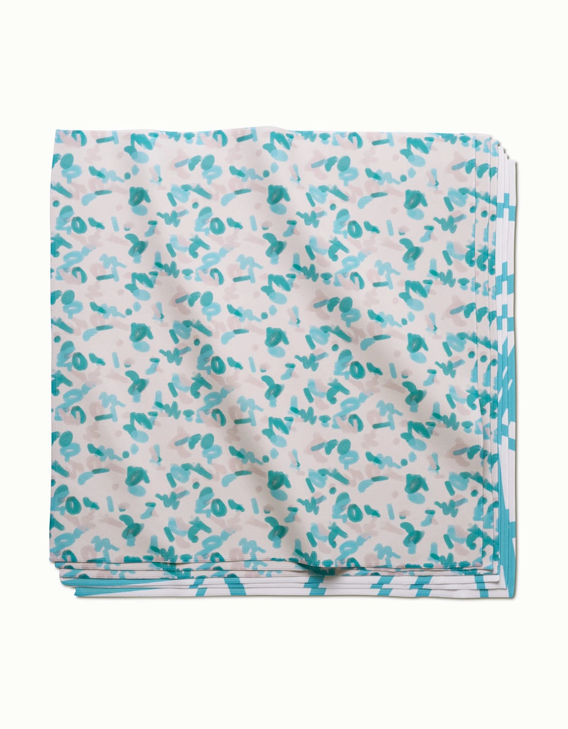 The GEOMETRY Playful Blues eco-friendly dinner napkin features a white background with teal and gray abstract shapes plus a teal-and-white patterned border.