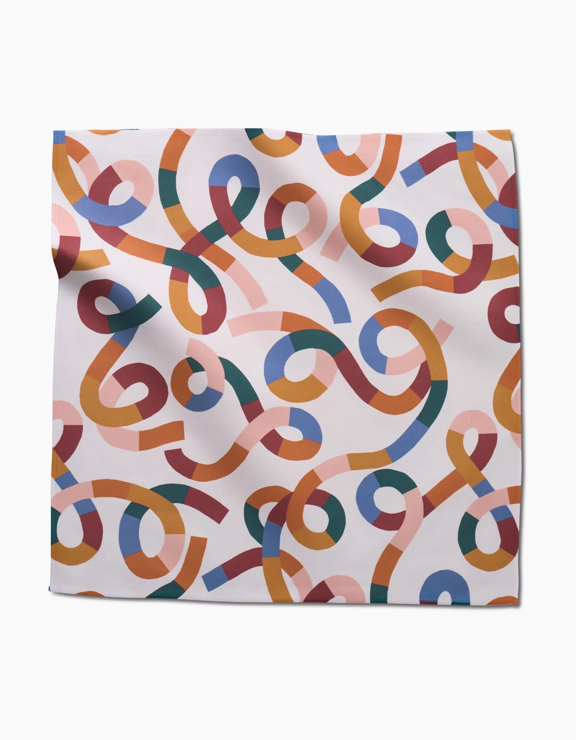 The Rainbow Squiggles napkin by Claire Iglesias is a square, eco-friendly Geosuede cloth featuring colorful intertwined ribbons on white, creating a lively abstract design.