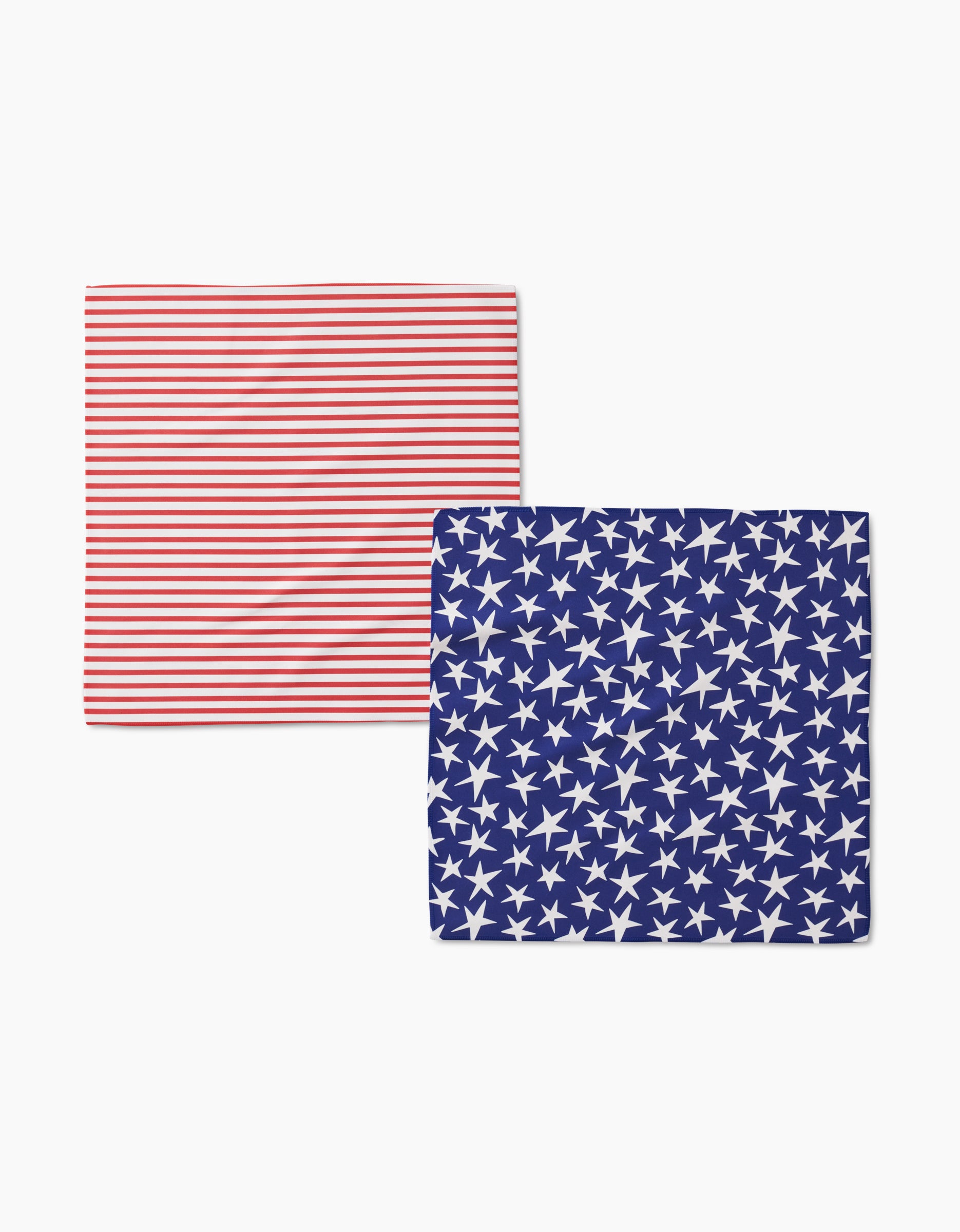 The Mindfulnice Stars And Stripes Dinner Napkin Set features two rectangular geosuede cloths—one with red and white stripes, the other with white stars on a blue background—evoking elements of the American flag.