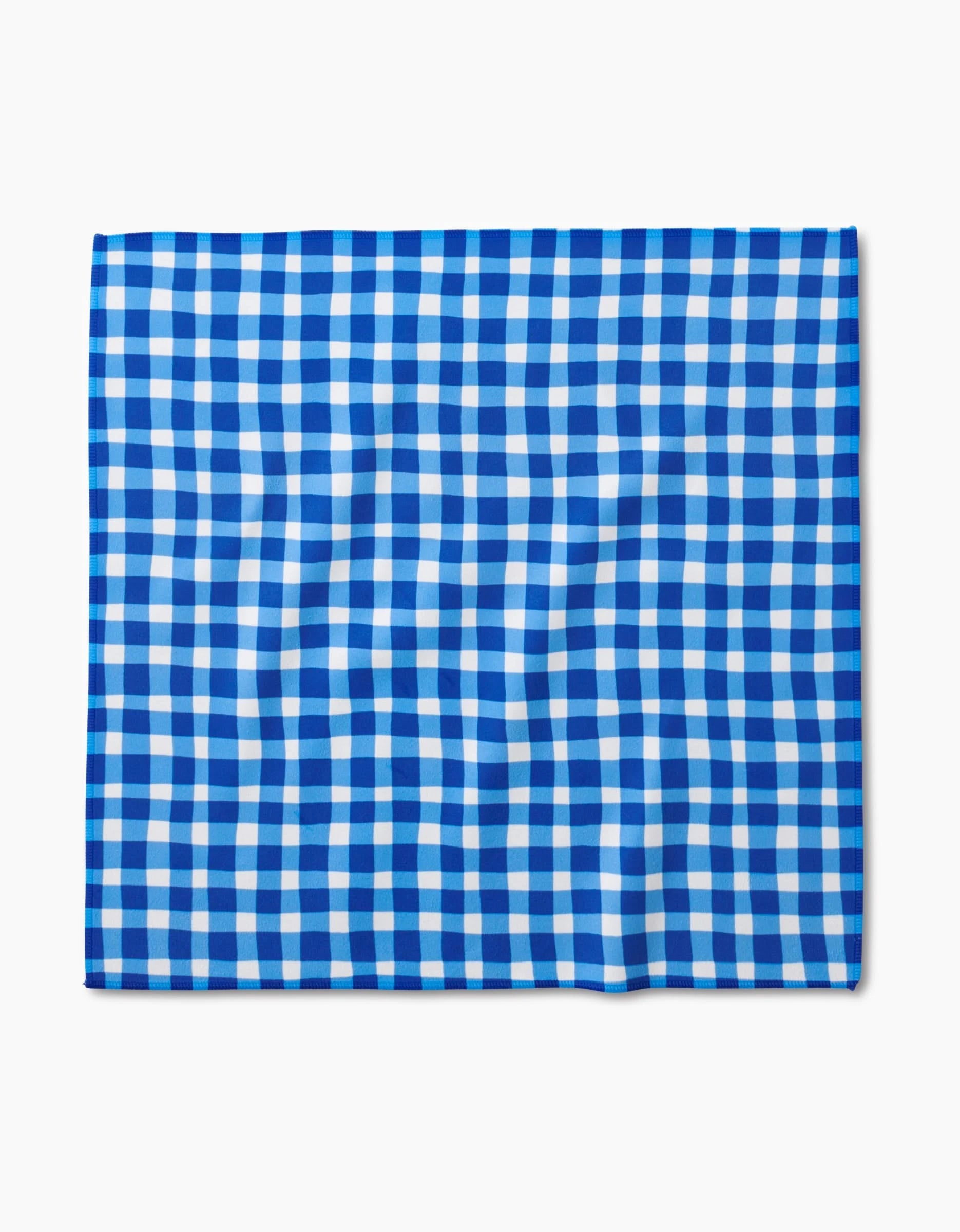 The Danelys Sidron Summer Plaid square dinner napkin features a blue and white gingham pattern, crafted from Geosuede fabric with post-consumer recycled materials for an eco-friendly touch.