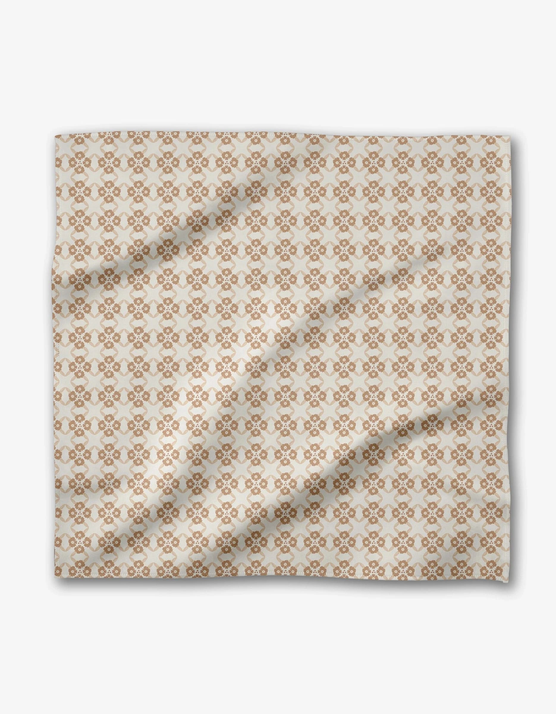 Sweet Boho by Hufton Studio features a light fabric with an intricate brown geometric diamond and circle pattern, shown flat with soft folds—ideal for eco-friendly reusable dinner napkins.