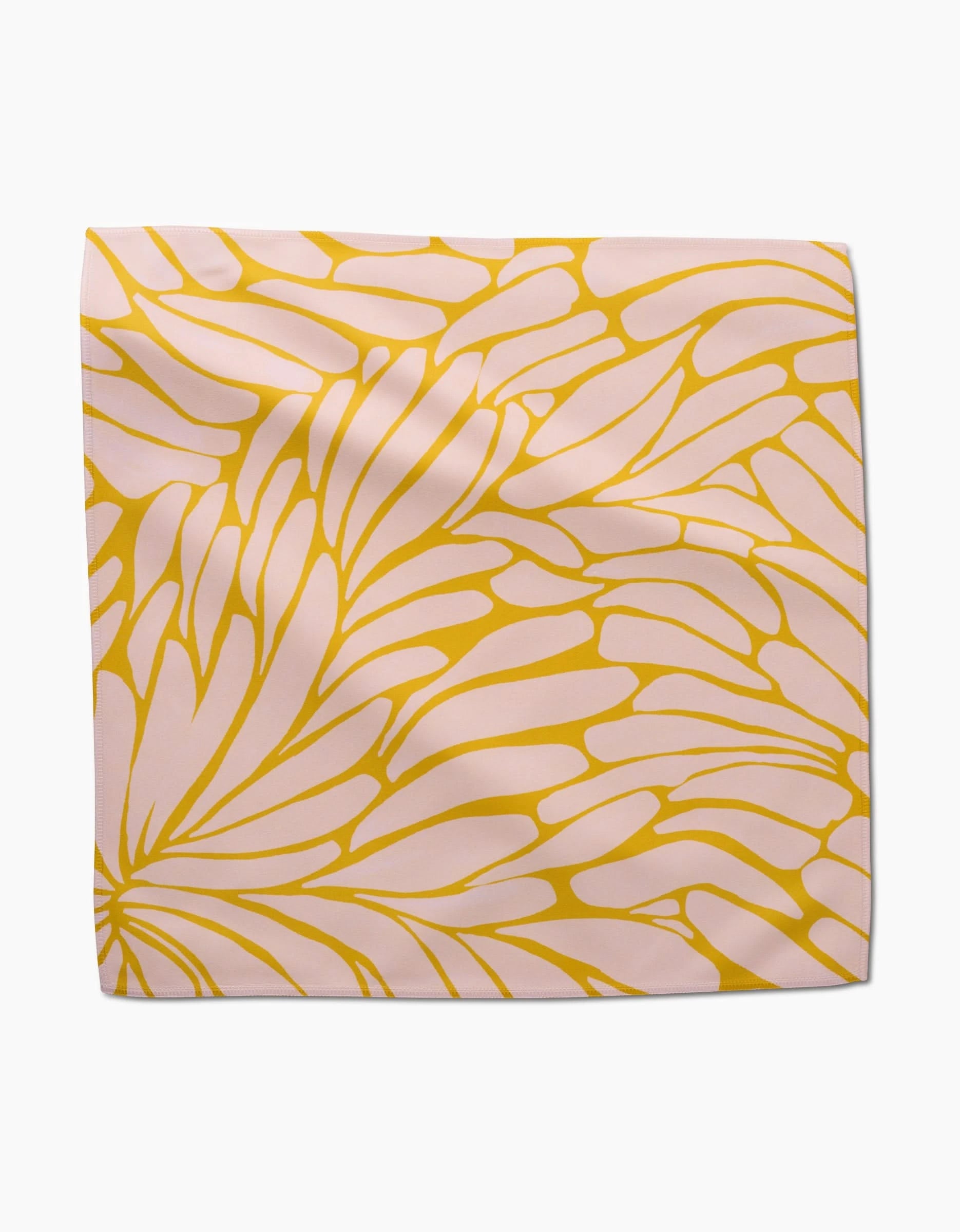 Tenderhearted by GEOMETRY is a square Geosuede scarf featuring a pink background with an abstract yellow floral pattern, soft folds, smooth texture, and an eco-friendly design.
