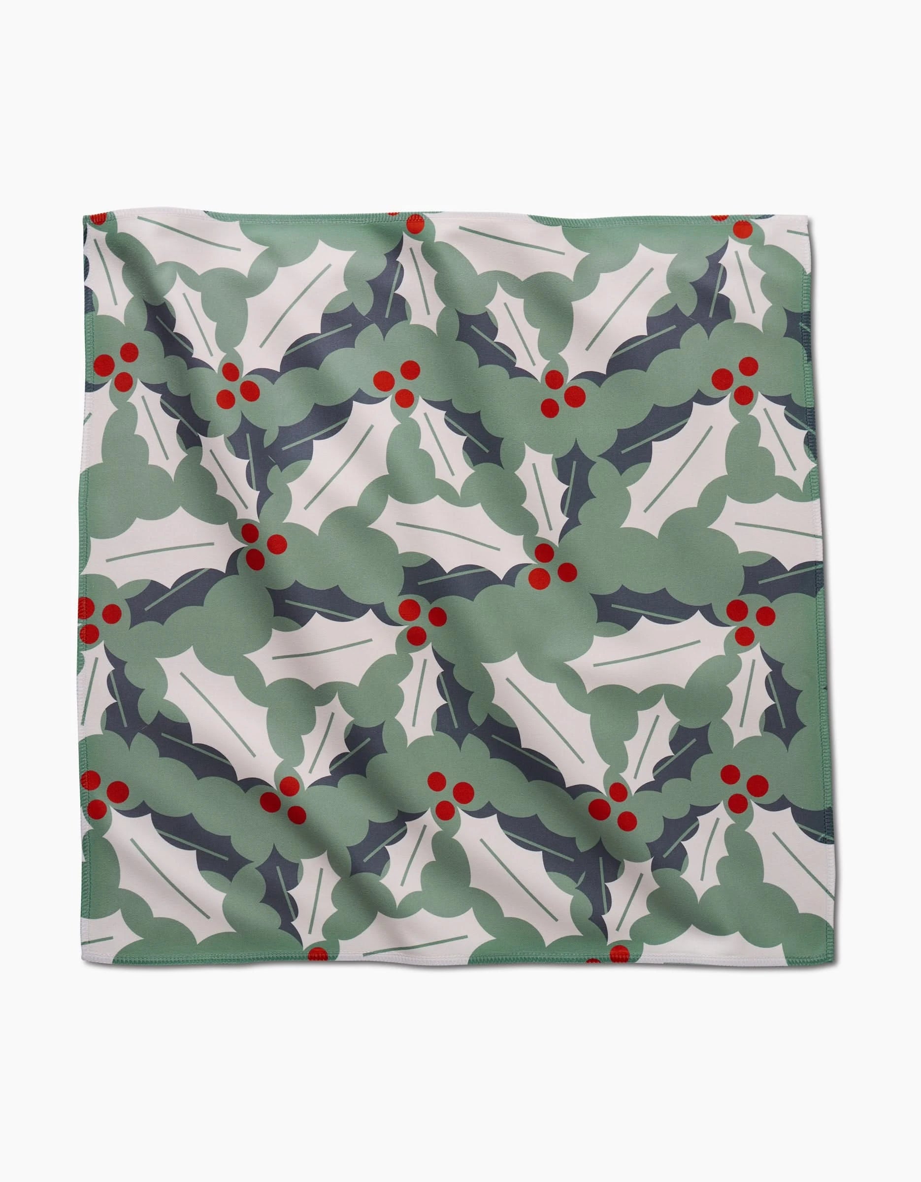 The Winter Wonderful napkin set by Lizzie Clark features square cloth napkins with green holly and red berry patterns on white, adding a festive, eco-friendly touch to your holiday celebrations.