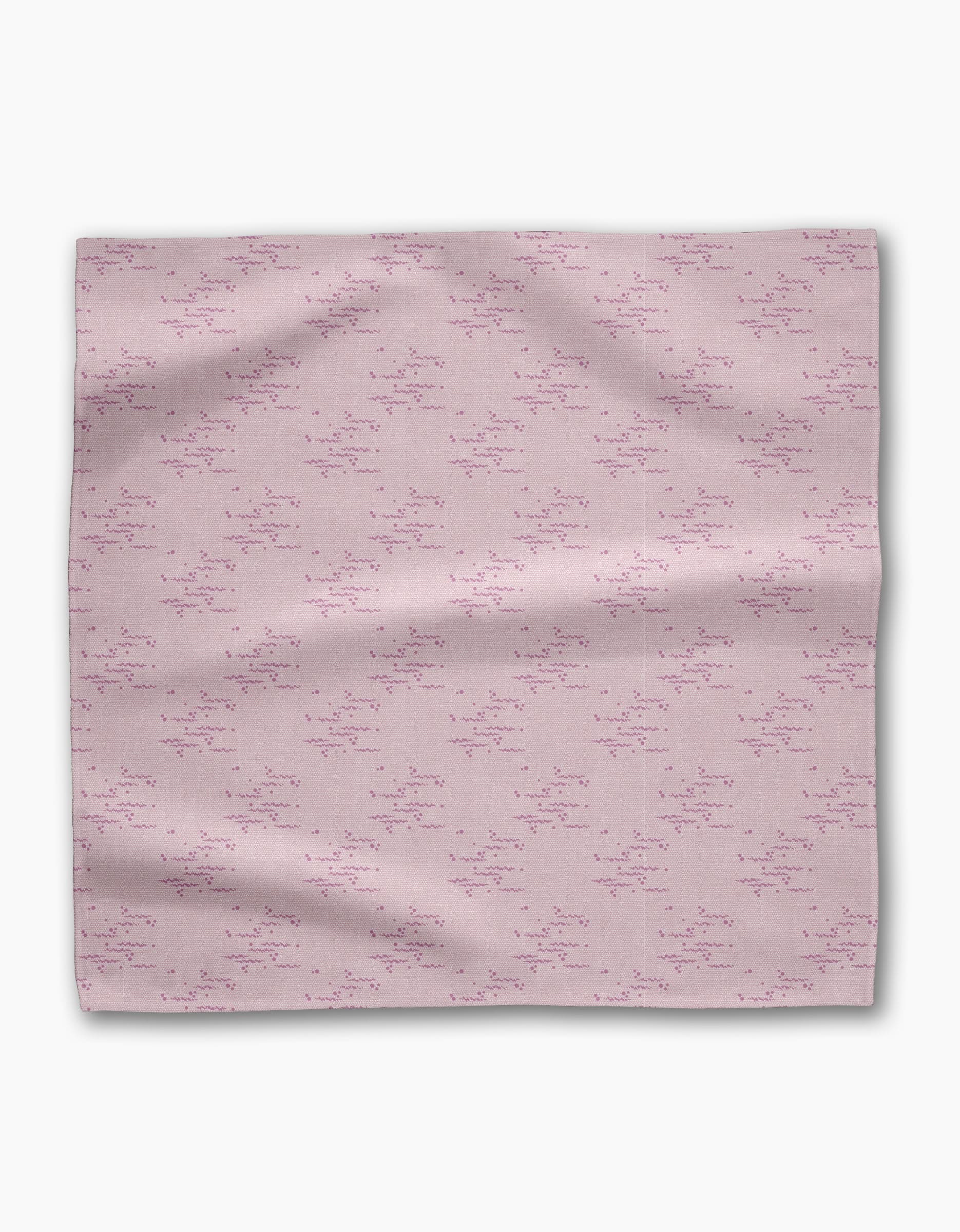 The Geometry Bubble Ditzy Dusty Rose is a soft pink reusable fabric napkin featuring a subtle pattern of small, scattered dark pink lines and dots, shown flat against a white background.