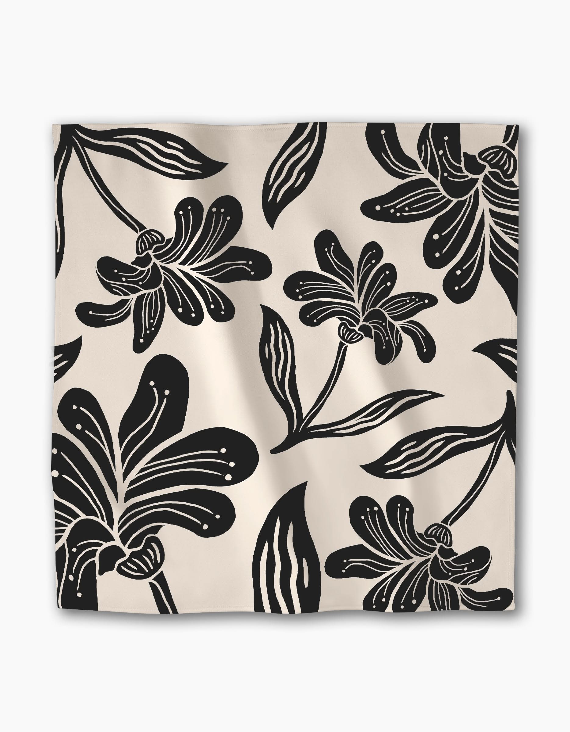 The Geometry Giant Lush Floral dinner napkin set features a bold black and white floral pattern with large, stylized flowers—a stylish, reusable square cloth napkin perfect for dining.