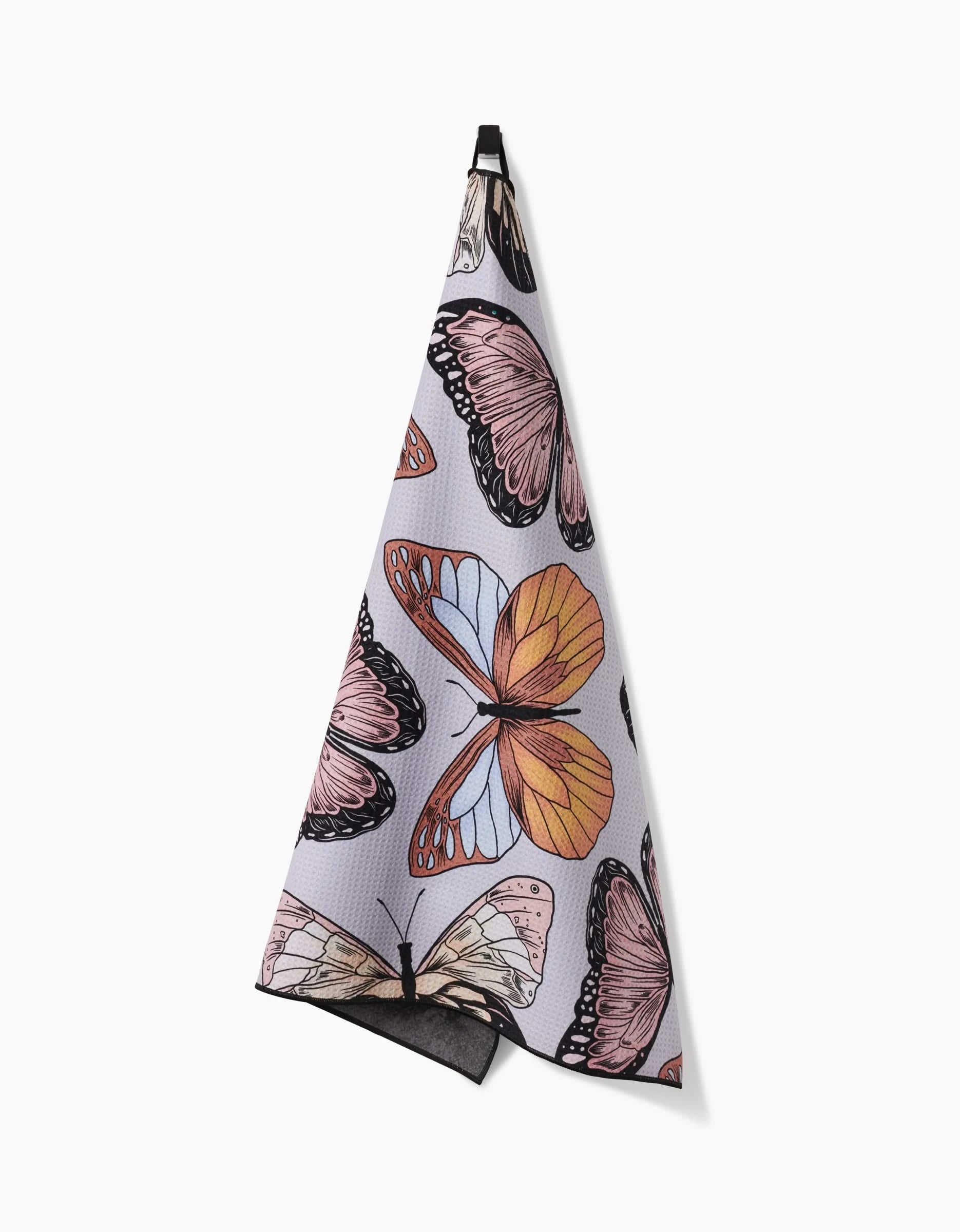The Geometry Cute Butterflies hanging towel is highly absorbent and features a colorful butterfly pattern in pink, orange, and cream on a light background.