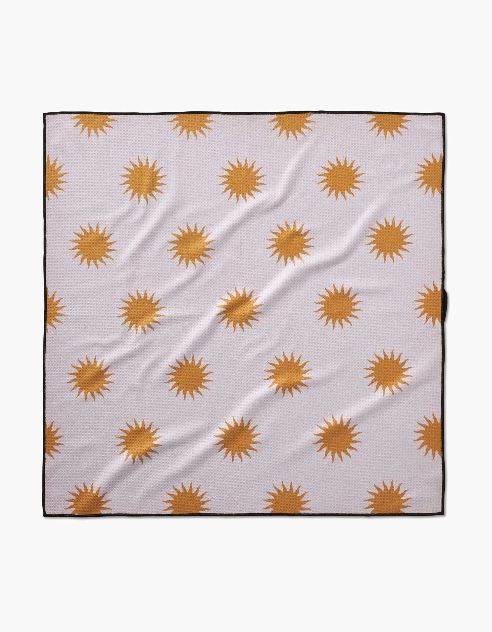 The Geometry Feeling Sunny Dog Towel is a square, highly absorbent, quick-drying blanket with a white background and evenly spaced orange sun patterns, finished with a thin black border.