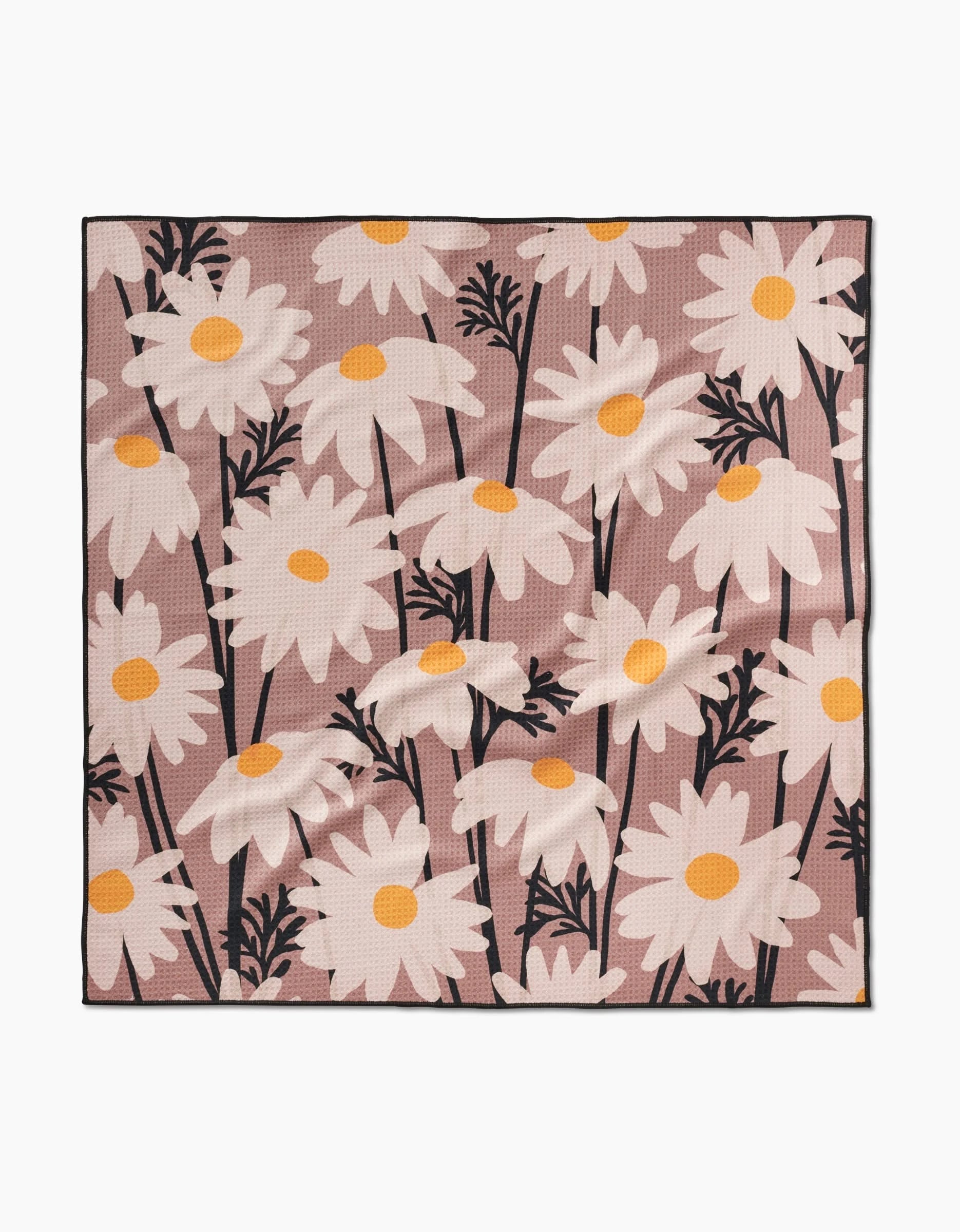 Sweet Daisies by Geometry: a square fabric featuring large white daisies with yellow centers and black stems on a muted pink background, made from recycled materials.