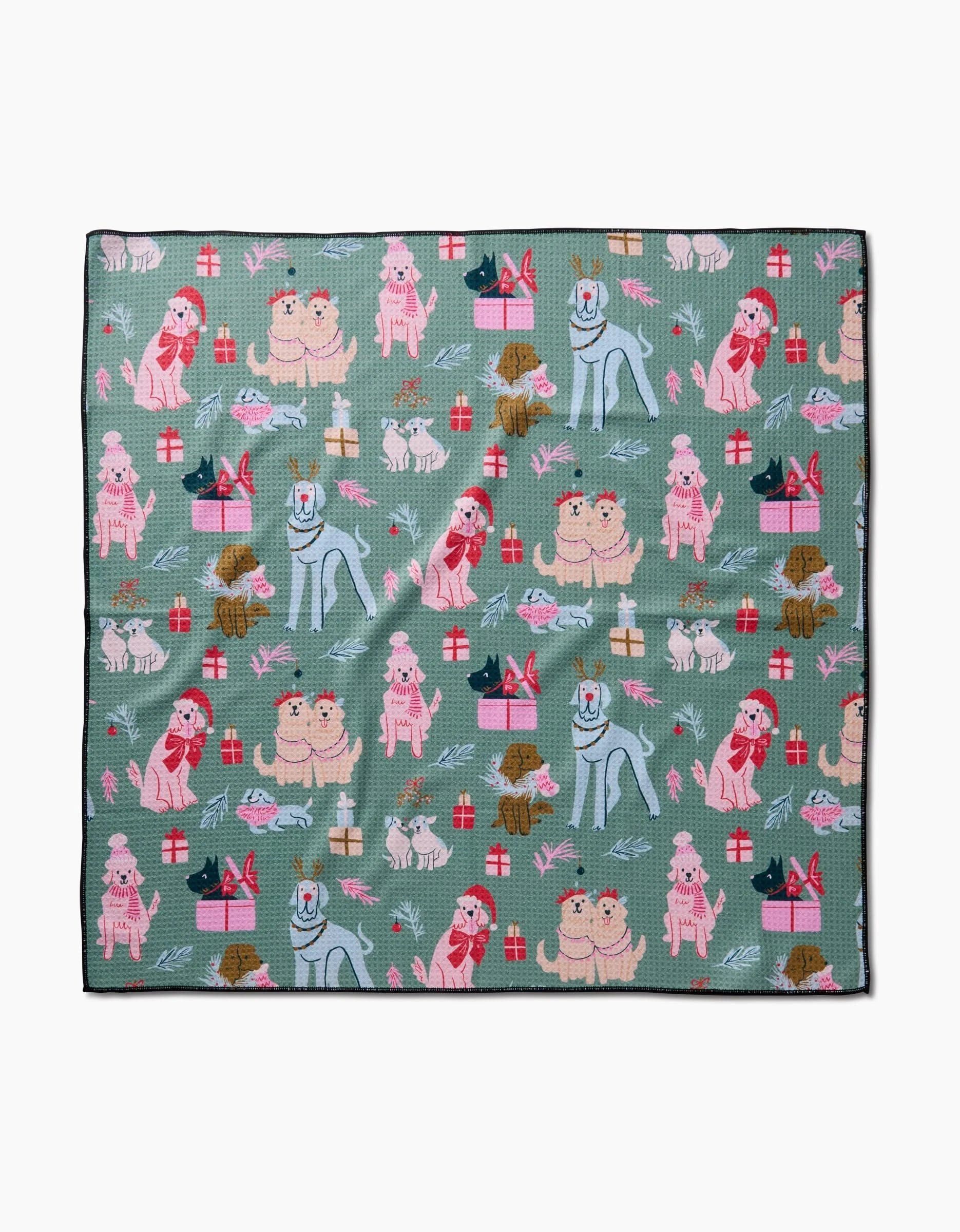 The Christmas Doggos blanket by Janna Sue Design is green, made from recycled materials, and features illustrated dogs, gifts, and bones in festive holiday colors and playful poses.
