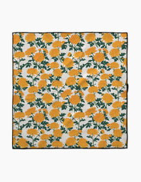 The Vaishali Design Studio Chrysanthemum is a square cloth made from recycled materials, featuring vibrant yellow marigolds with green stems on white. Highly absorbent and perfect for use as dog towels or for everyday cleanup.