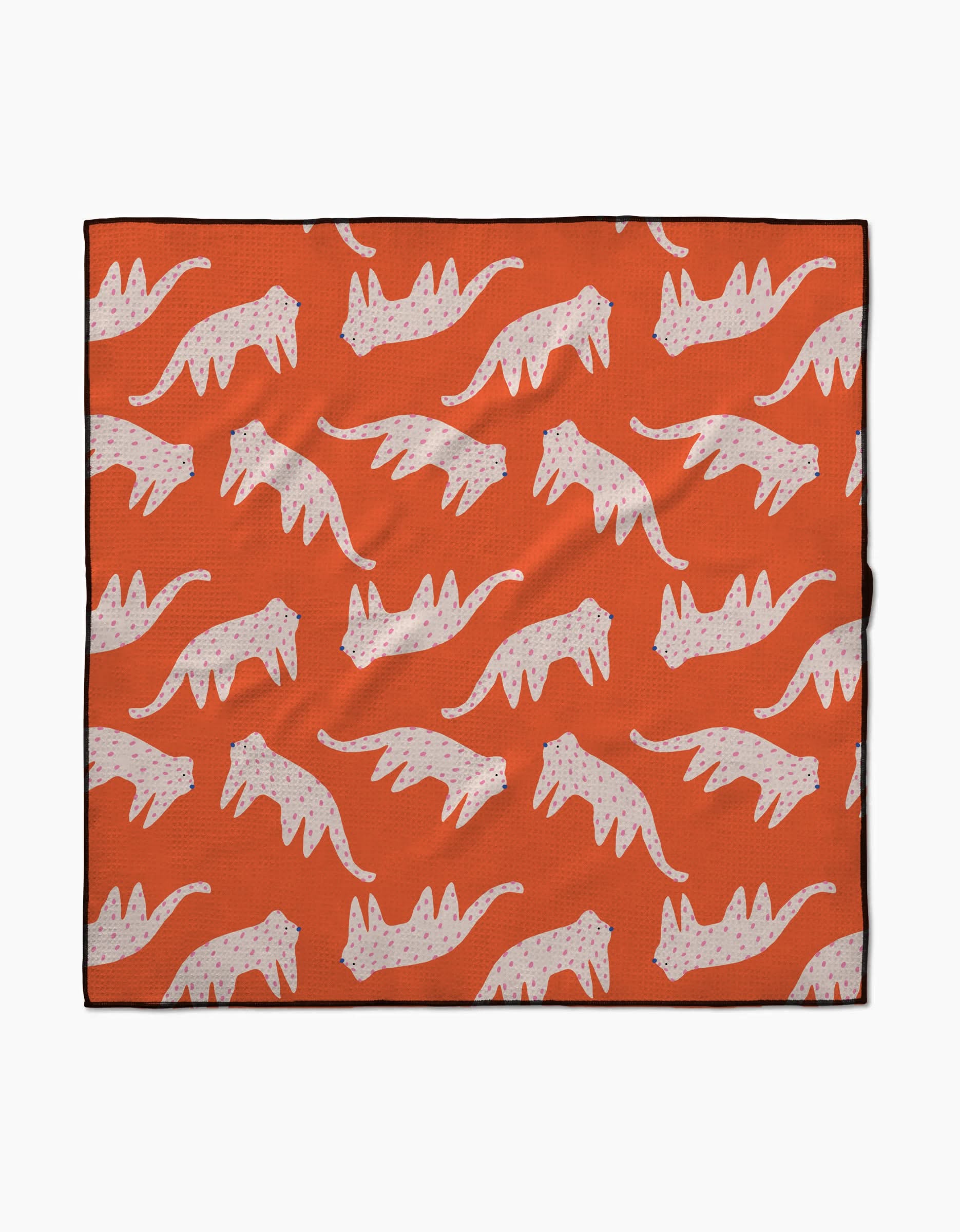 The Cute Cheetah blanket by Jennifer Bouron is lightweight and eco-friendly, featuring a repeating pattern of white cats with pink spots in a walking pose on an orange background.