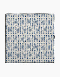 The Sardine Stripes mat by Hufton Studio is a rectangular white mat made from recycled materials, featuring rows of evenly spaced vertical blue fish and a black border.