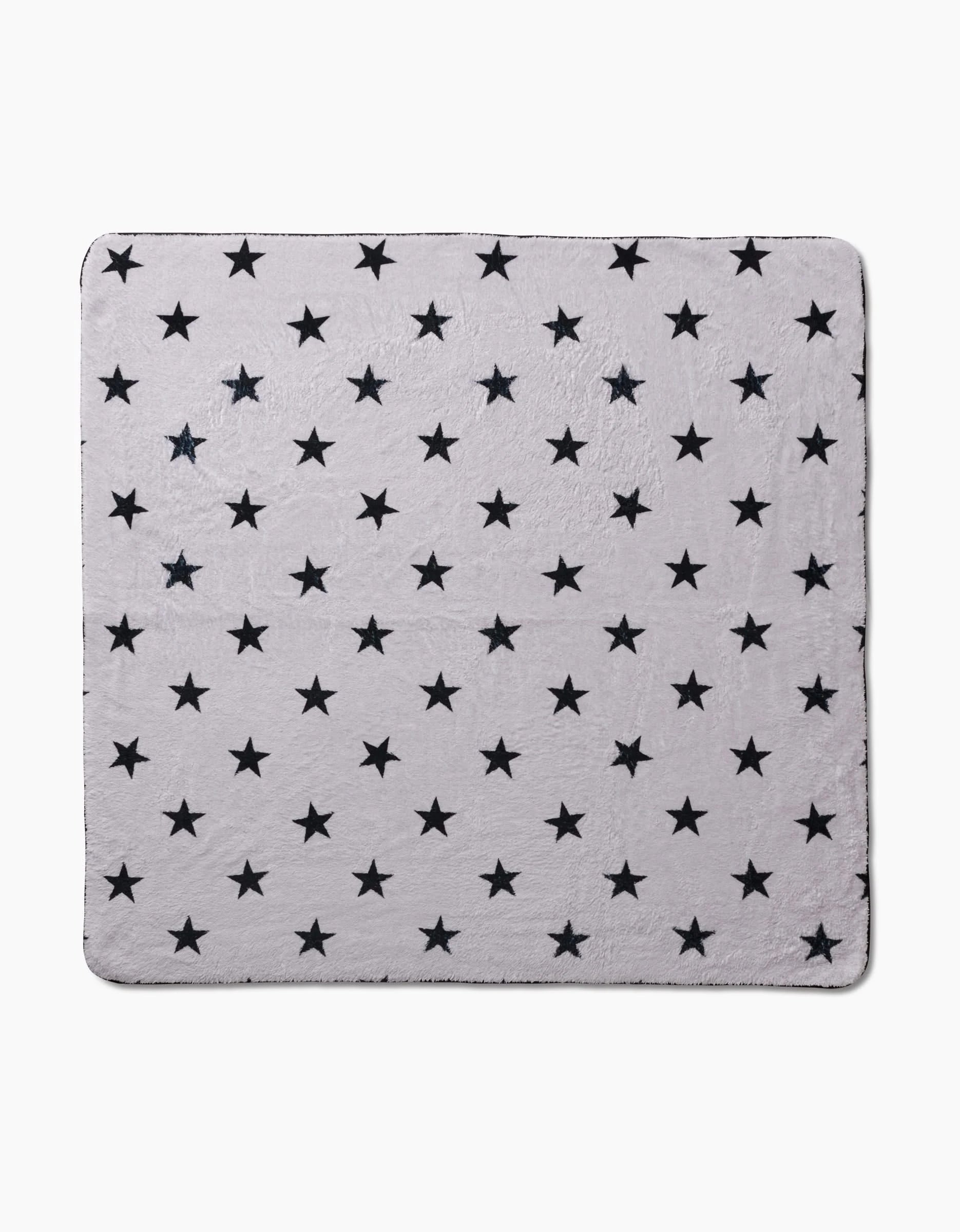 The Geometry Bark dog towel features a square shape, light gray color, soft plush texture, and ultra-absorbency. Its entire surface is patterned with evenly spaced black stars on a light gray background.