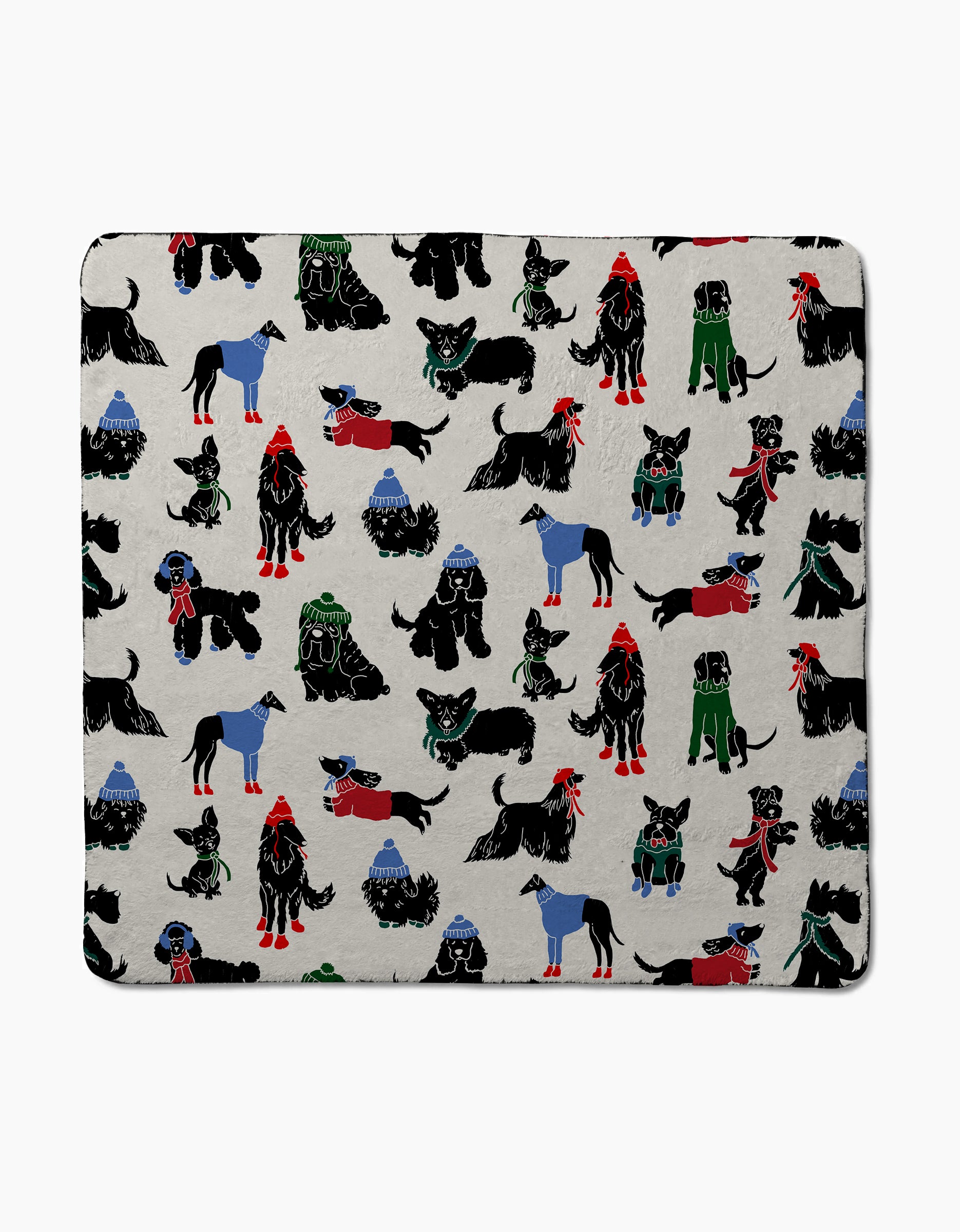 Dogue Magazine by Geometry showcases black dogs in colorful winter outfits with blue mountains on a light grey cover—an ideal cozy and cute pick for dog lovers.