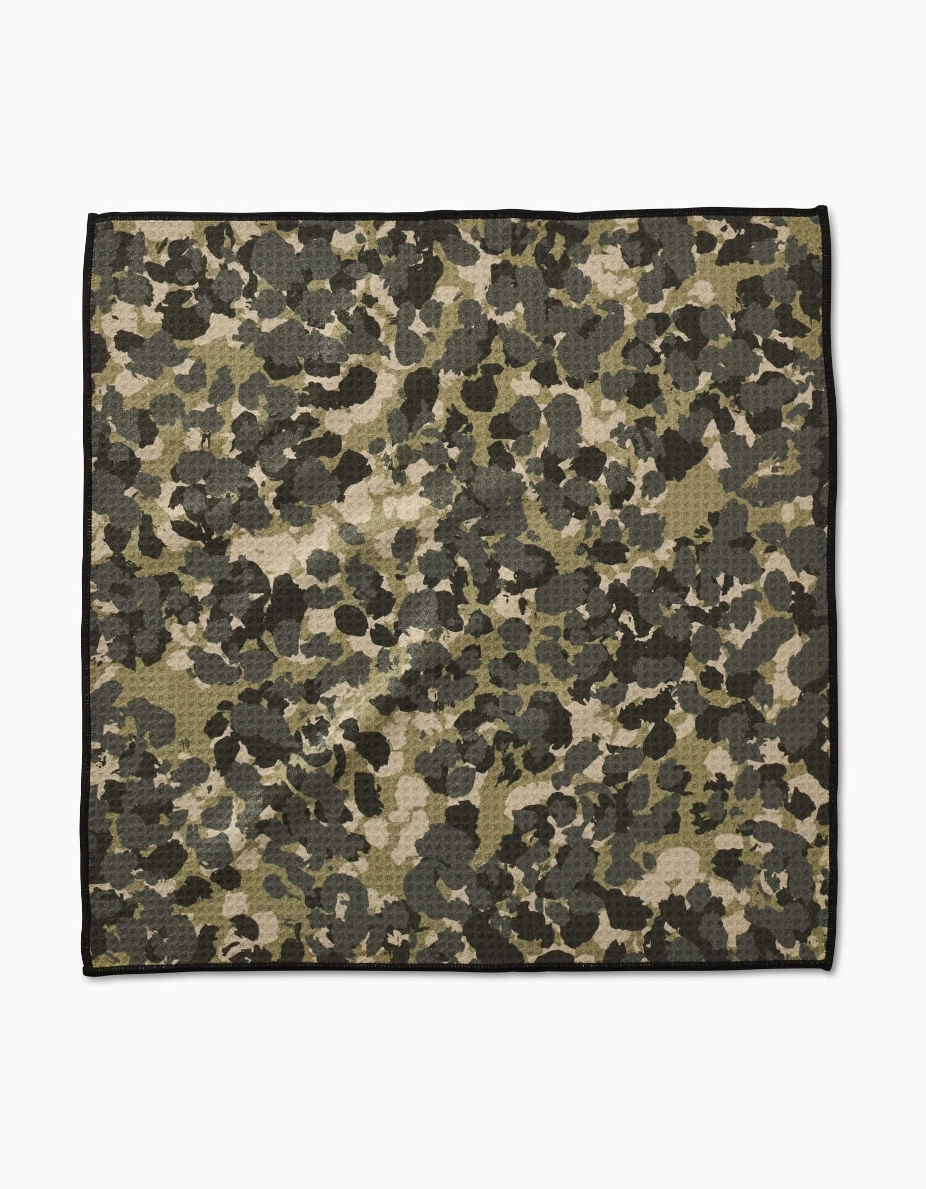 The Geometry Camo Paw Towel features a green, brown, and black camouflage pattern with a thin black border. Made from ultra-absorbent Geoweave fabric, it is shown flat on a white background.