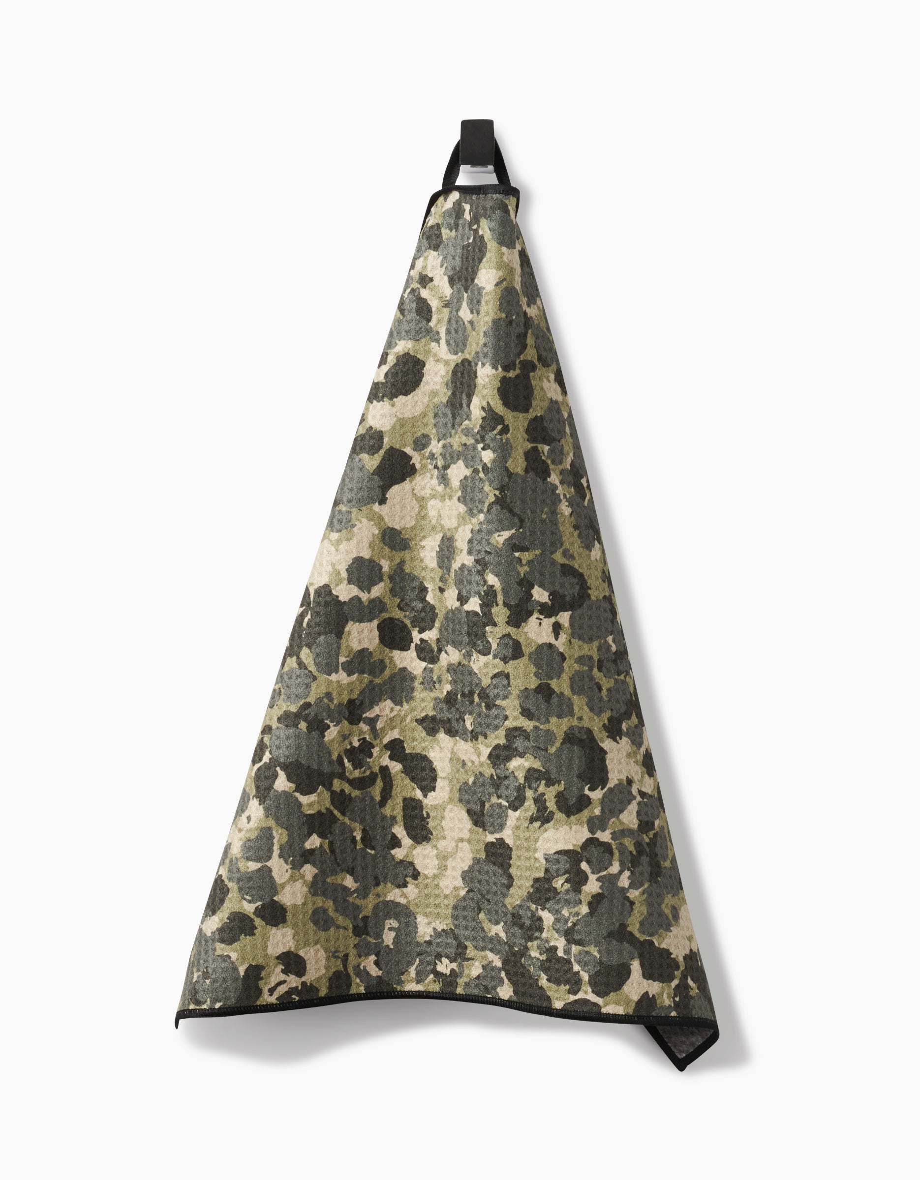 The Geometry Camo Paw Towel, crafted from ultra-absorbent Geoweave fabric with a green and brown camouflage print, is shown hanging by a black loop against a plain white background.