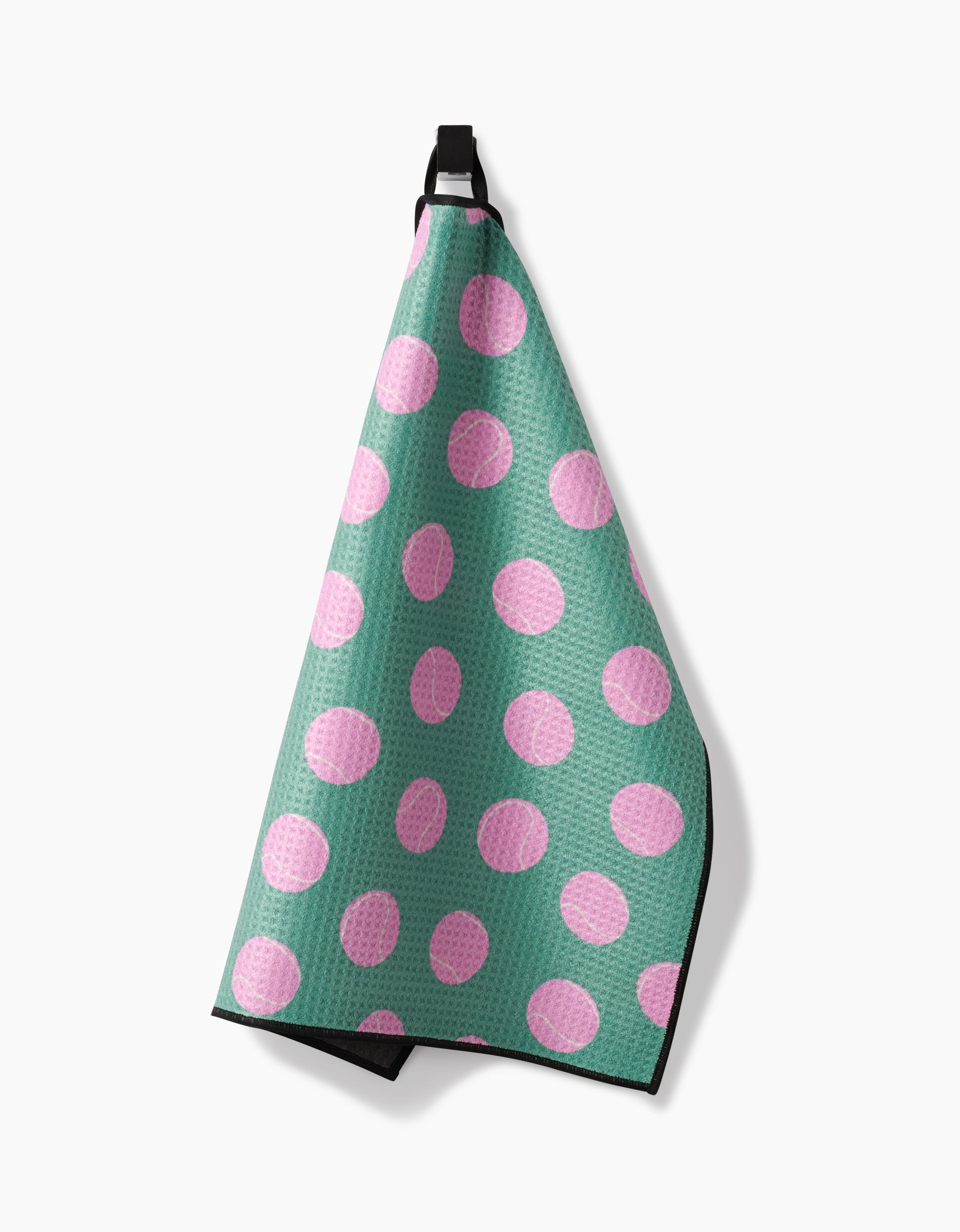 A Geometry Pink Ball Paw Towel featuring a waffle texture and large pink polka dots, made from ultra-absorbent Geoweave fabric, hangs from a black loop against a white background.