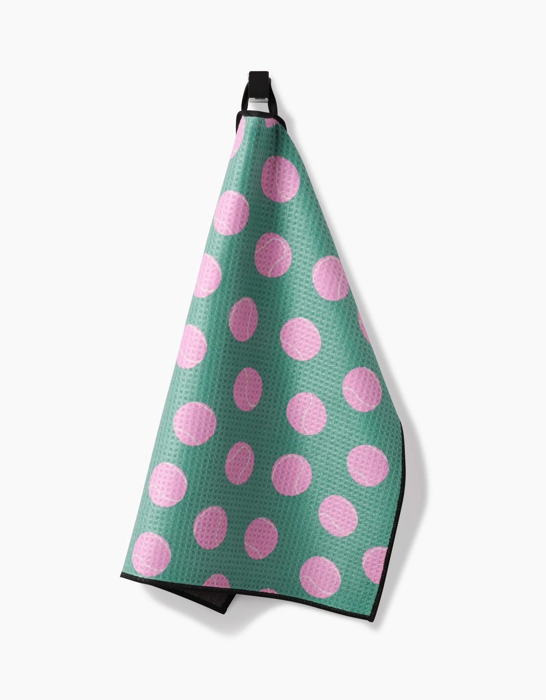 A Geometry Pink Ball Paw Towel featuring a waffle texture and large pink polka dots, made from ultra-absorbent Geoweave fabric, hangs from a black loop against a white background.