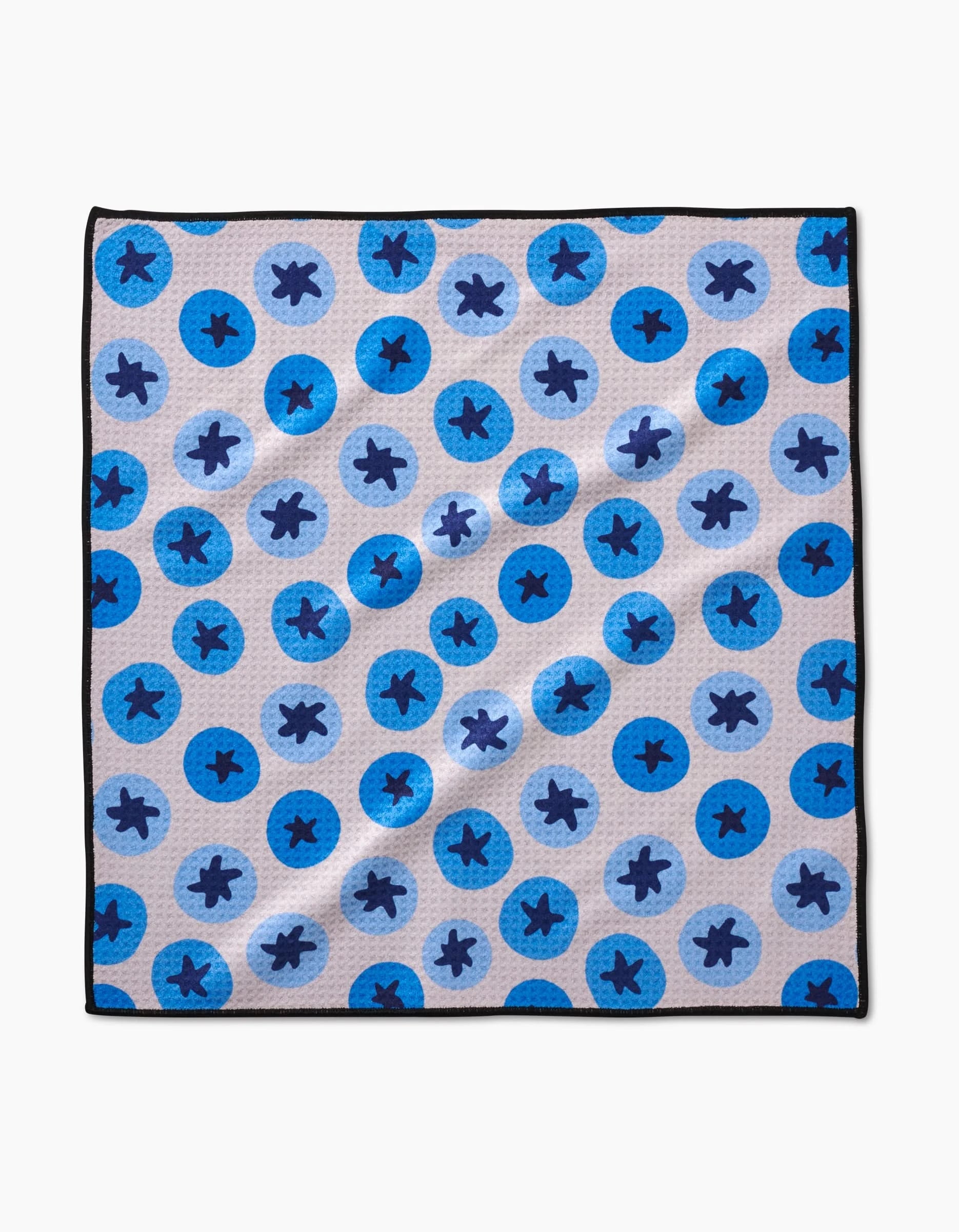 The Geometry Sweet Blueberries Paw Towel features a blue circle pattern on a light background with black border, crafted from ultra-absorbent Geoweave fabric.