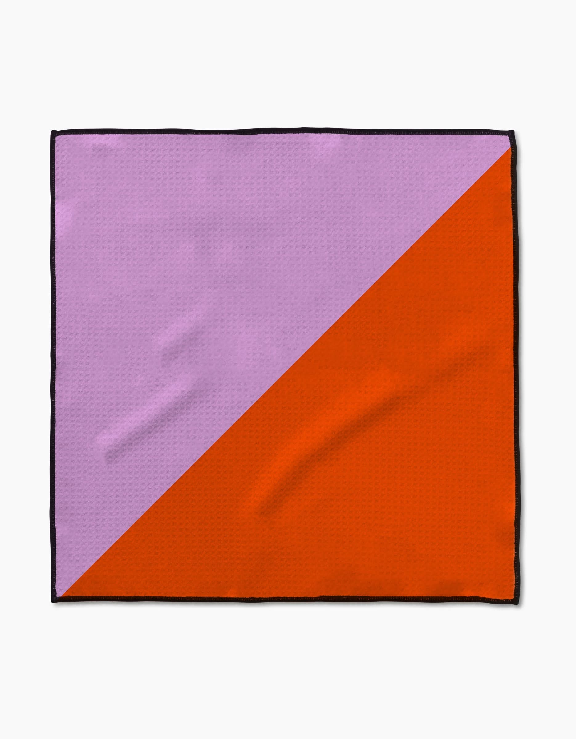 The Geometry Bold Horizon Paw Towel features a diagonal color split—light purple in the upper left, bright orange in the lower right—with a slim black border, crafted from ultra-absorbent Geoweave fabric for optimal drying.