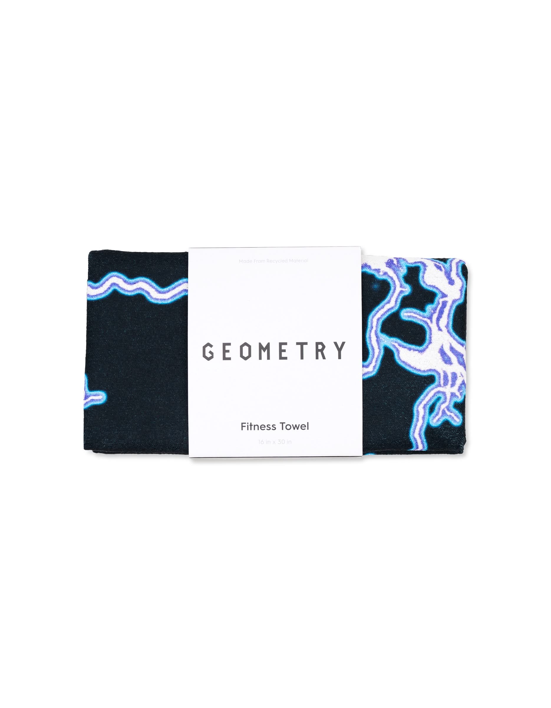 A folded GEOMETRY Magna - Electric Flash gym towel with blue and purple abstract lines on a black background, wrapped in a white label reading GEOMETRY Fitness Towel.