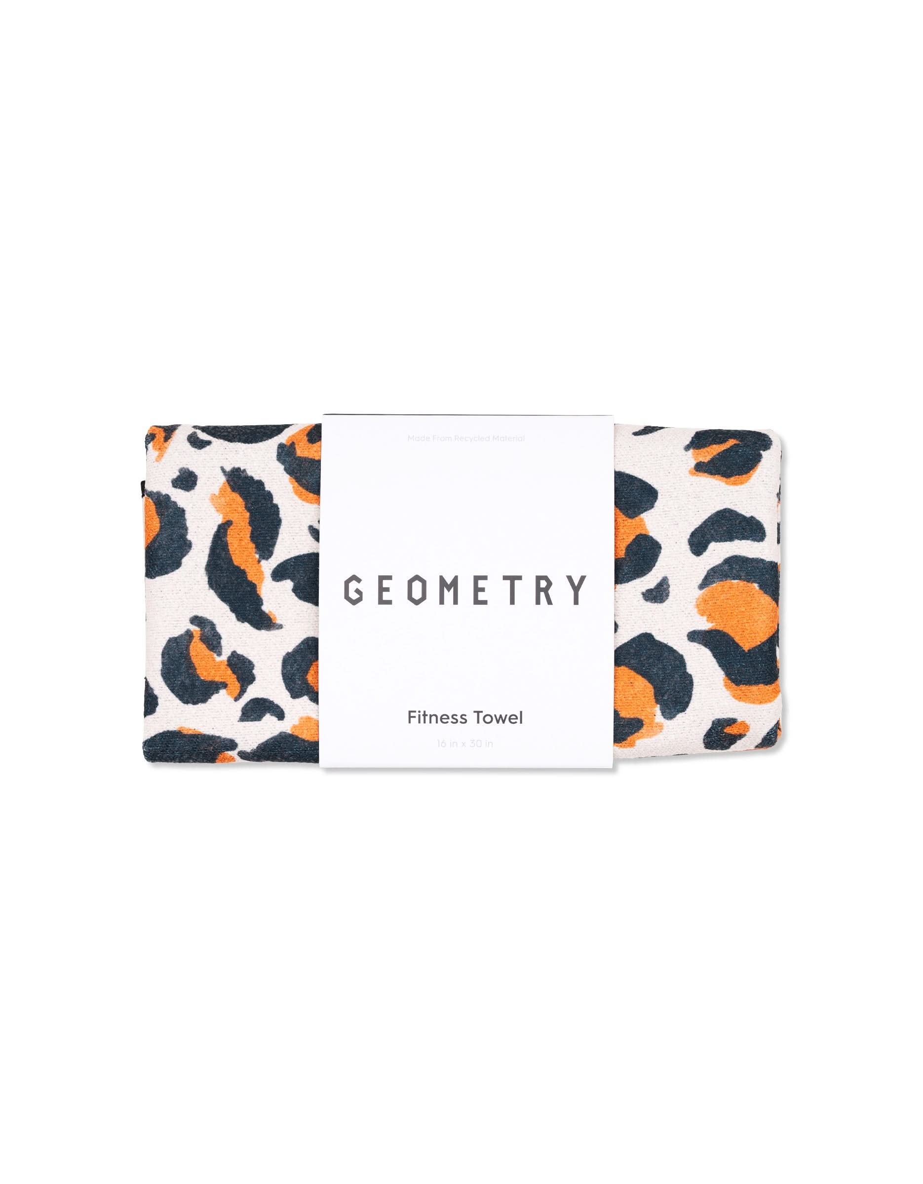A folded ultra-absorbent GEOMETRY fitness towel called Magna - Leopard features a black and orange animal print and is wrapped in a white label with the brand name.