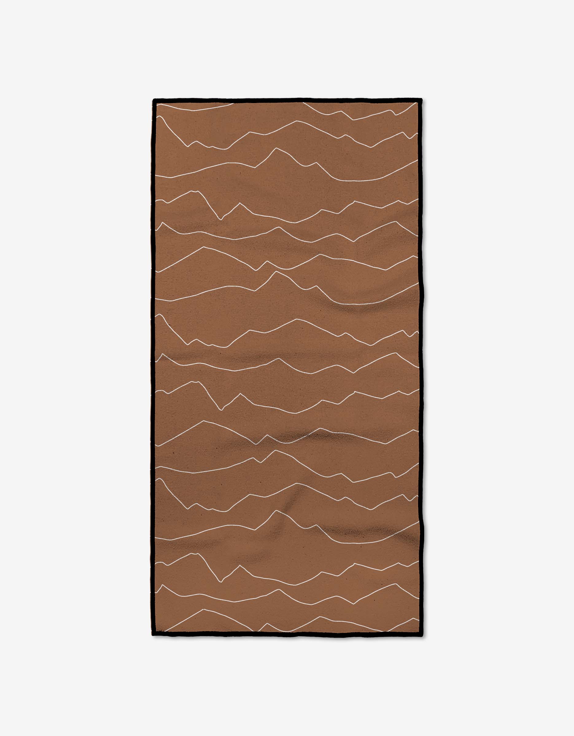 The Lined Mountains Fitness Towel by Coit Creative is a rectangular brown towel with a black border, crafted from ultra-absorbent recycled materials and features thin, wavy white lines running horizontally.