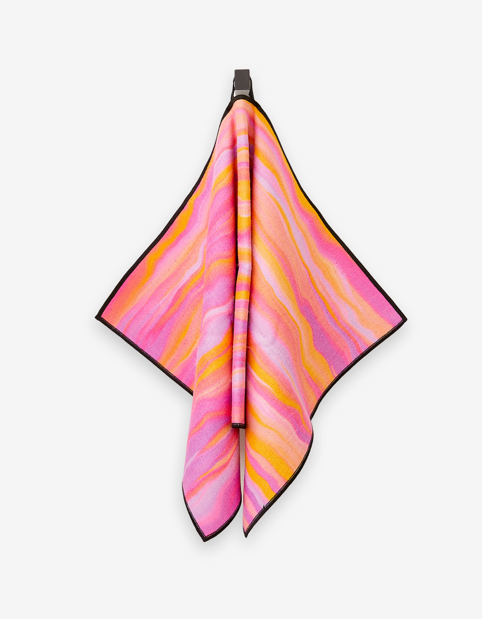 The Rush fitness towel by GEOMETRY hangs from a hook, showcasing vibrant pink, orange, and yellow wavy stripes with a black border. Made from ultra-absorbent recycled materials, its displayed against a plain white background.