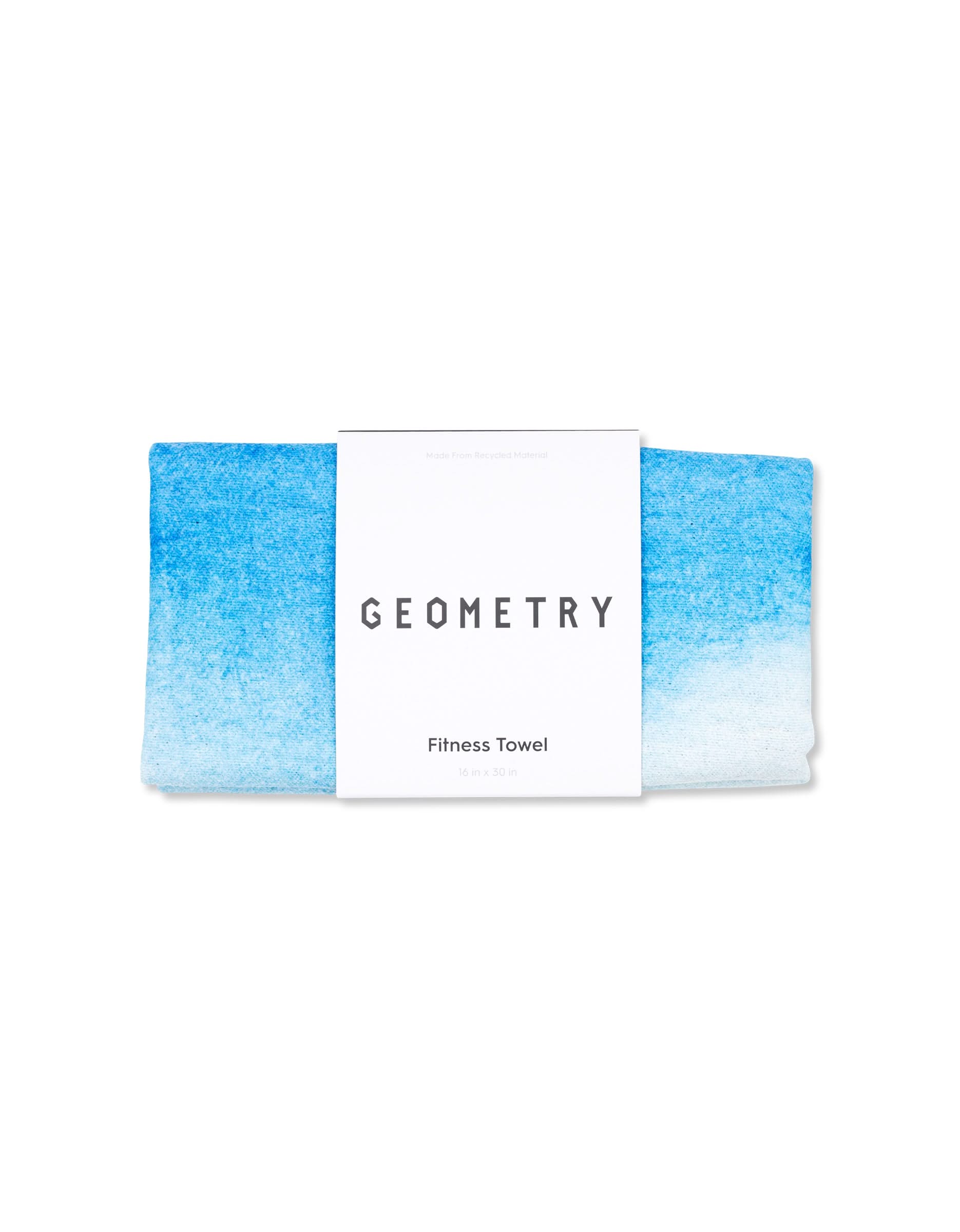 A folded blue and white gradient towel, wrapped in a white label reading GEOMETRY and Magna - The Soul—a super absorbent fitness towel ideal for gym use.