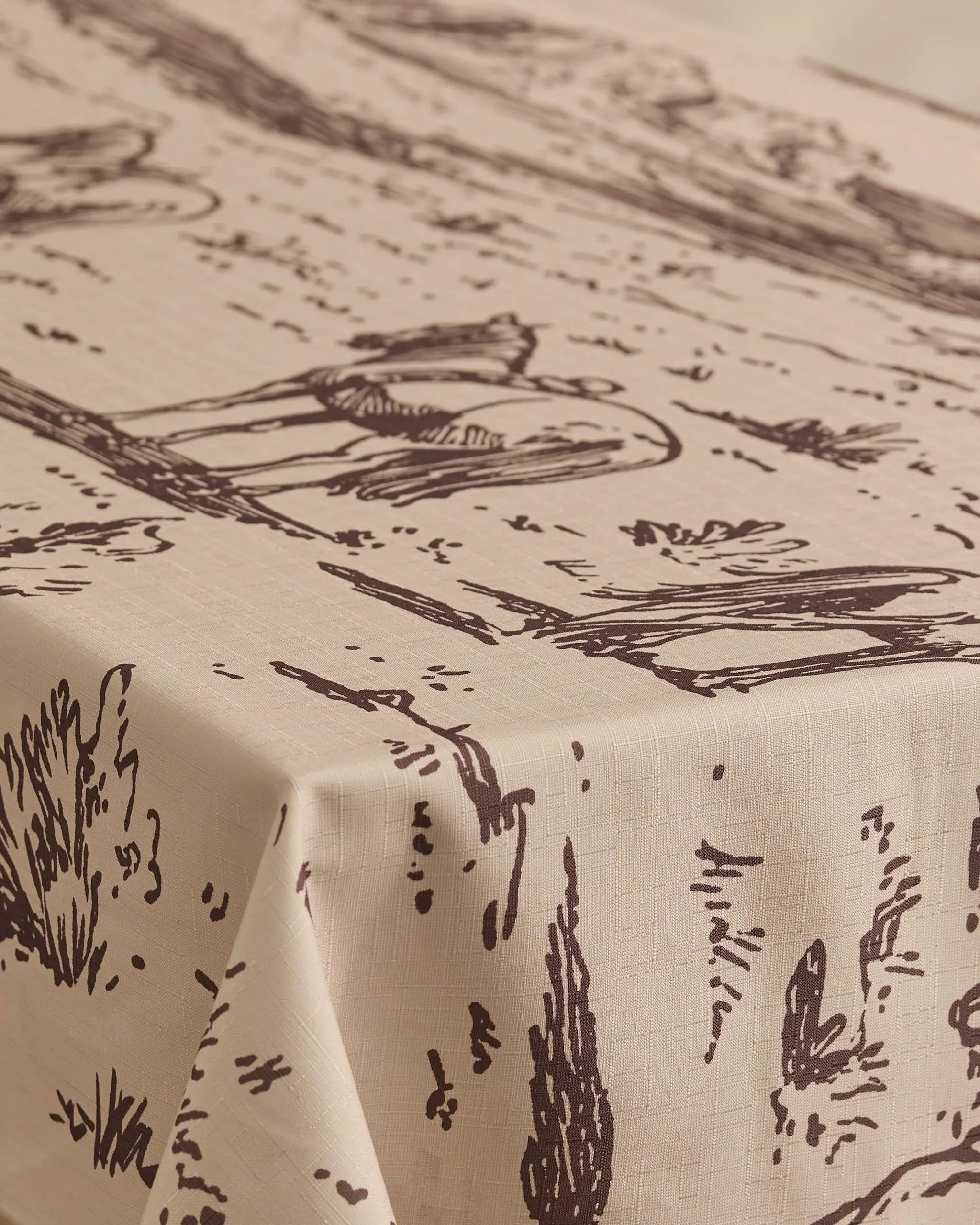 The Geometry Western Scene tablecloth, in beige with a dark brown scenic line drawing of birds and reeds, offers a textured, stylish, and stain-resistant design—practical for everyday use.
