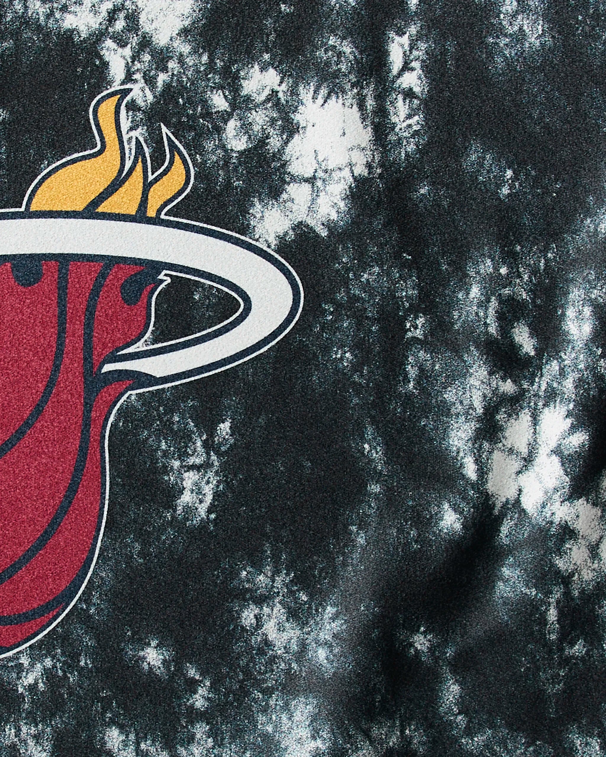 The image shows the Miami Heat logo—a flaming red basketball through a white hoop—set on a black and white marbled background, inspiring the Heat Flash NBA fitness towel by Geometry.