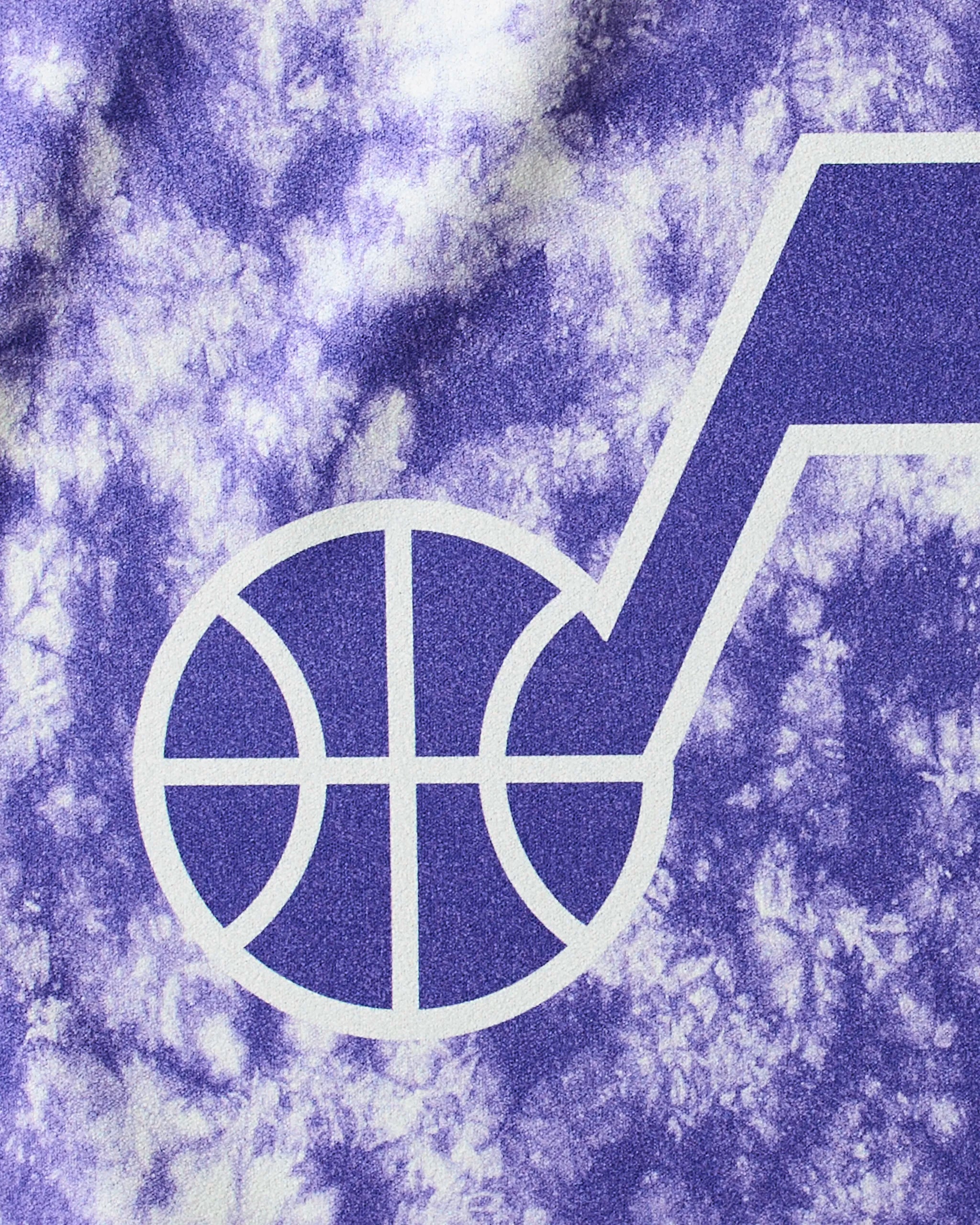 The image features the Jazz Flash by Geometry—a stylized basketball attached to a musical note logo over a purple and white tie-dye background, ideal for an NBA fitness towel or quick-drying gym towel.