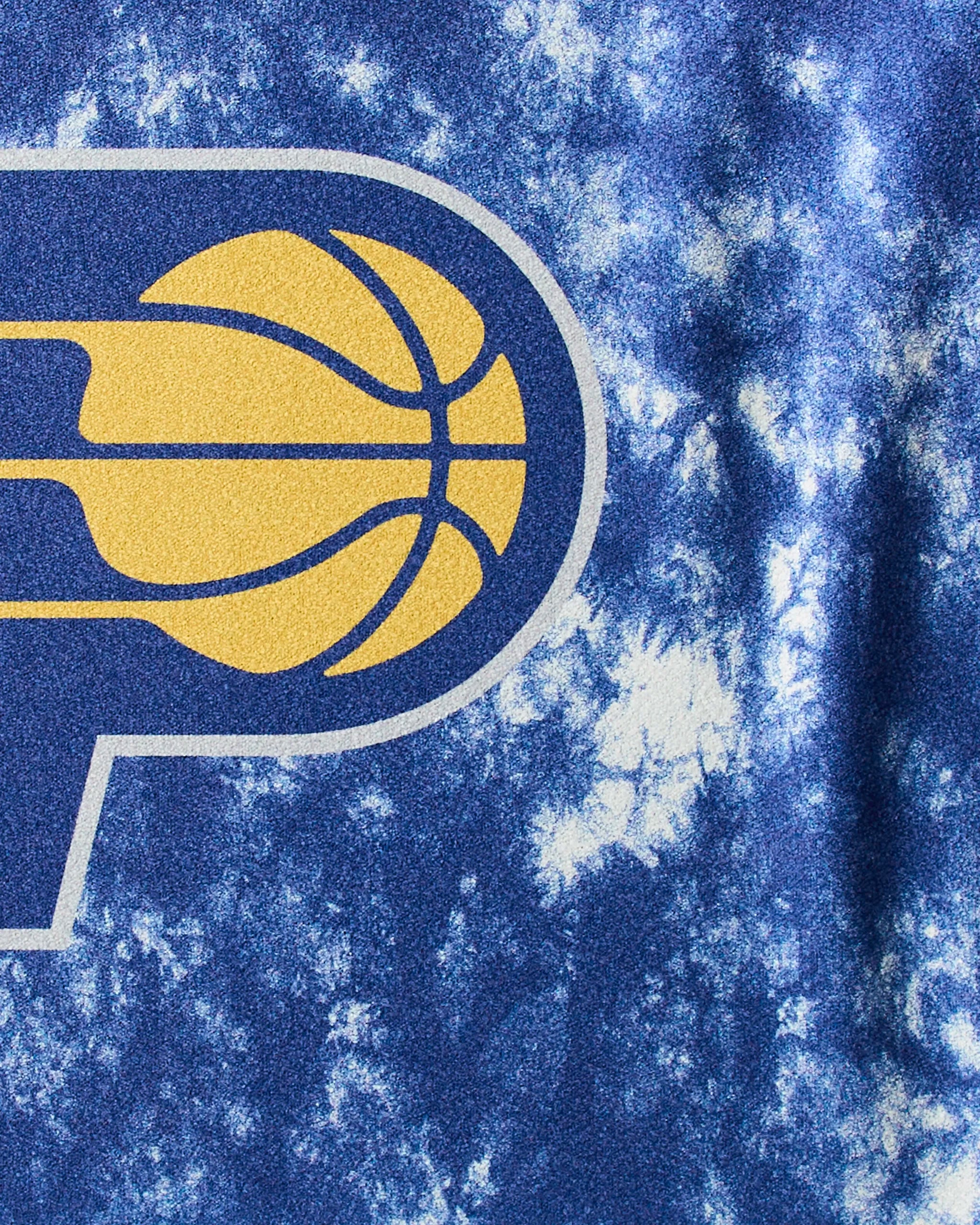 Close-up of the Pacers Flash by Geometry—a fitness towel featuring the Indiana Pacers logo with a yellow basketball and blue lettering on a marbled blue and white background, perfect for workouts.