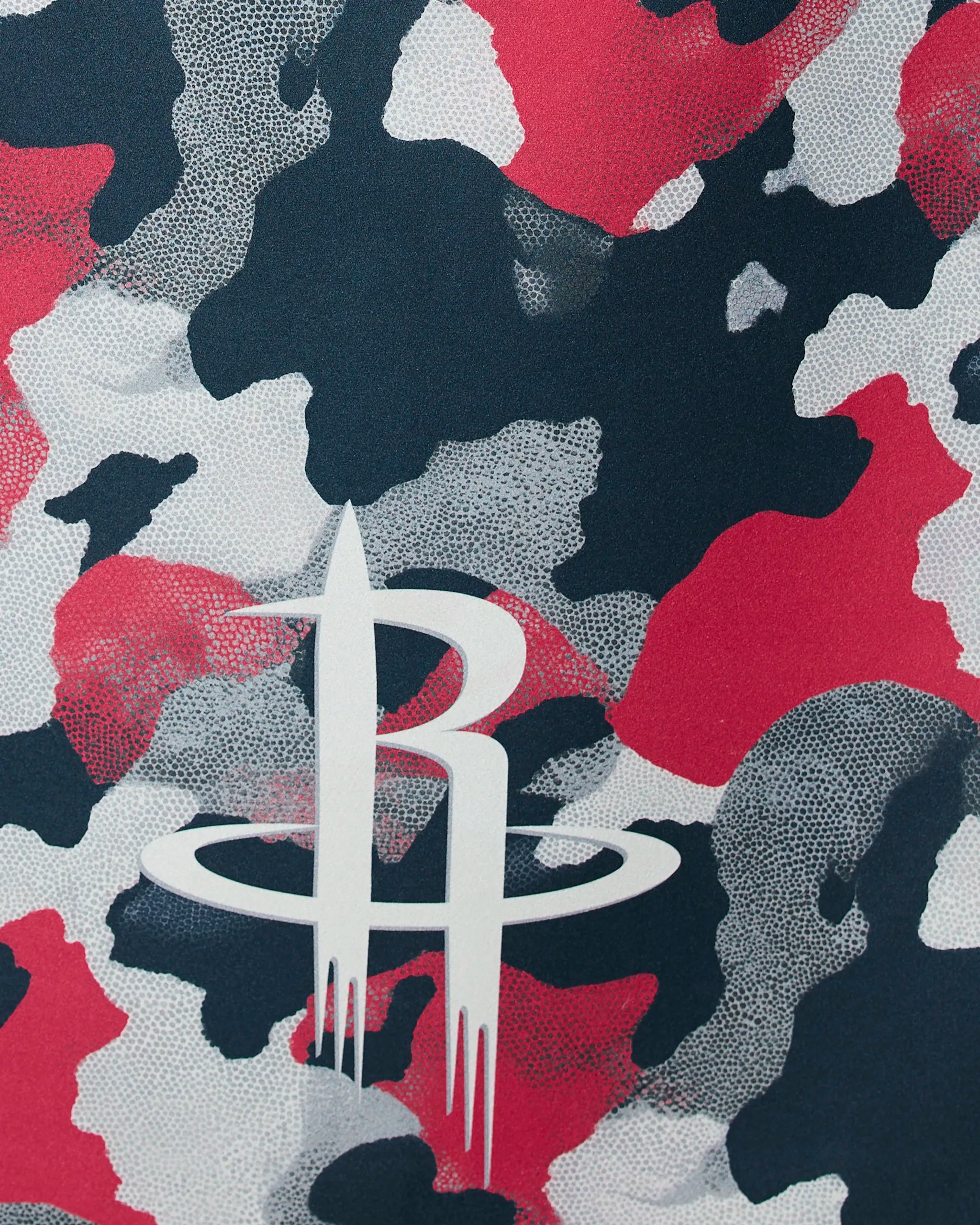 The Rockets Camo by Geometry features the Houston Rockets logo—a stylized white R with a ring—on a red, black, and white camo background.
