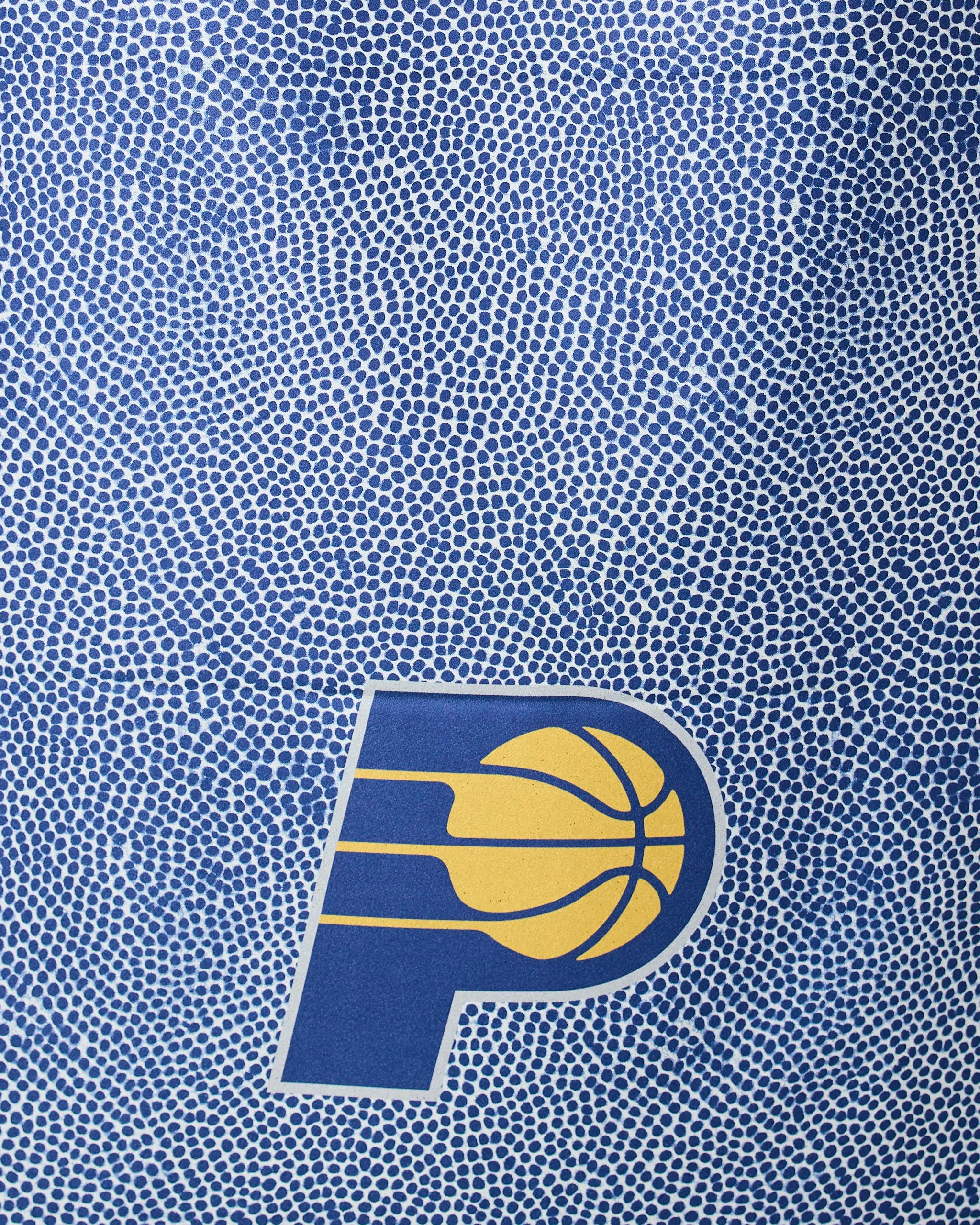 The Geometry Pacers Grip features a blue and yellow Indiana Pacers basketball logo set against a textured, pebble-patterned blue background that mimics the surface of a basketball.