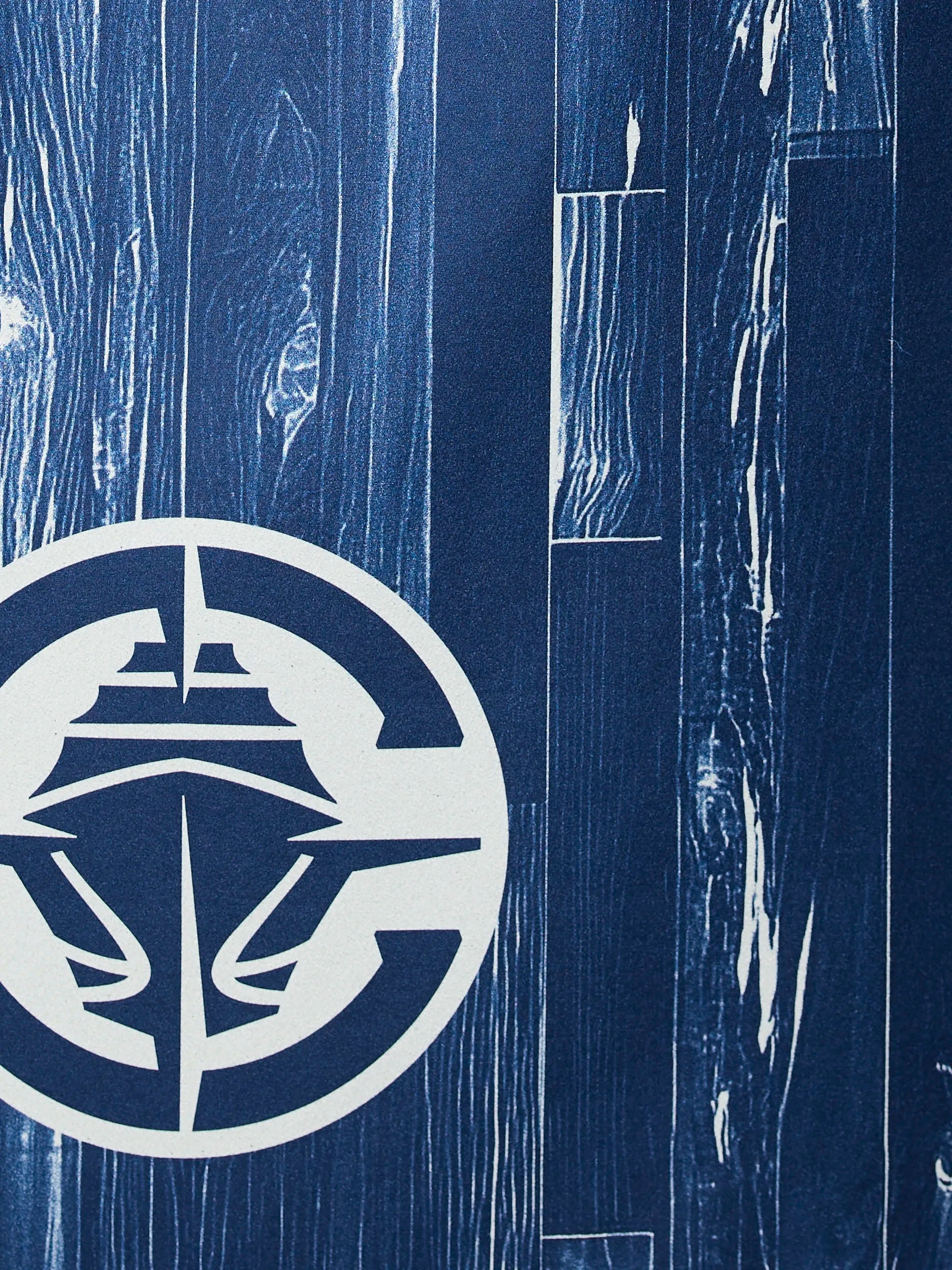 The Clippers Zone logo by Geometry features a stylized white ship in a circle on a blue background with a weathered wood plank design.